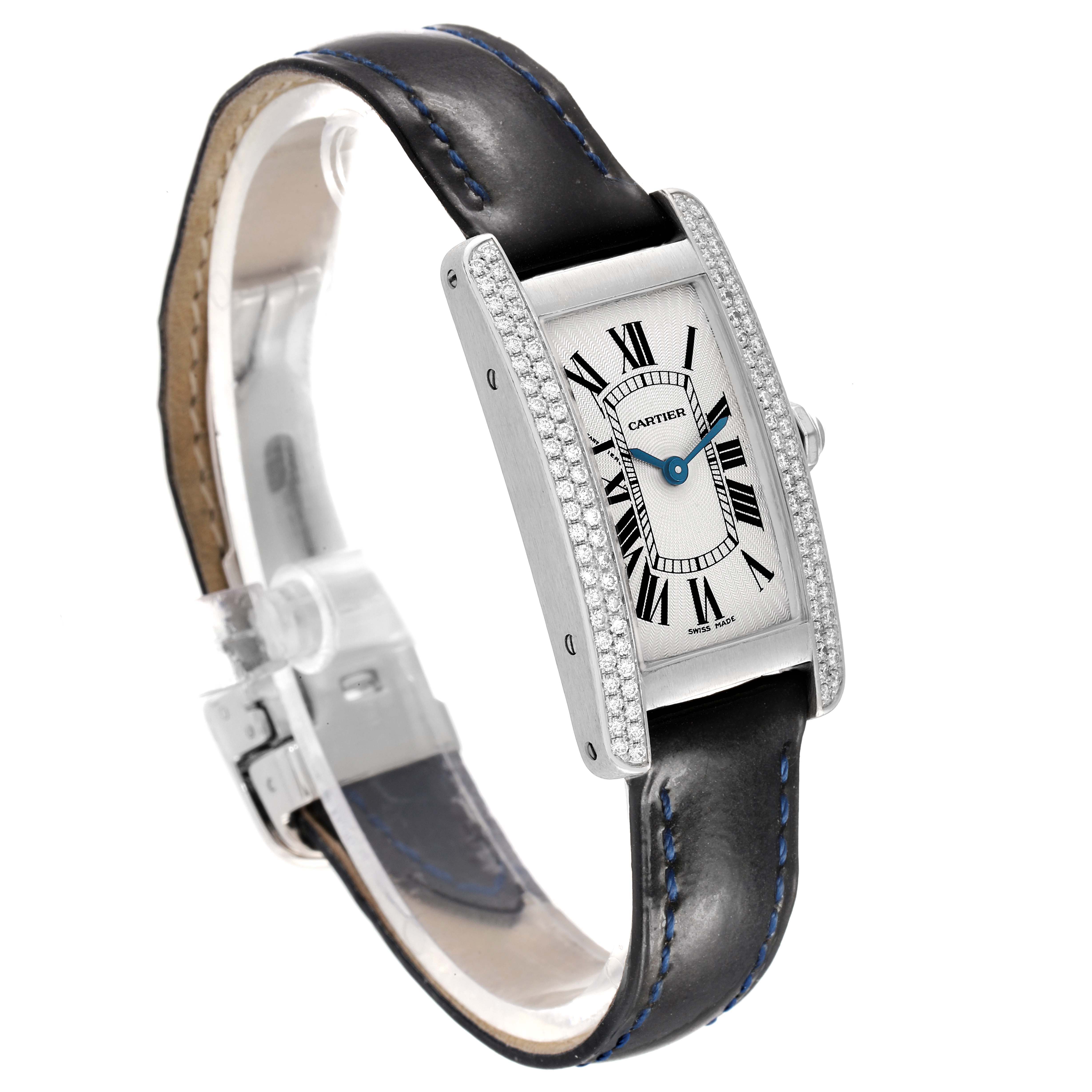 The Cartier Tank Americaine WB701851 Women's White Gold Silver Dial watch is shown at a 3/4 angle, highlighting the face, strap, and diamond-encrusted case.