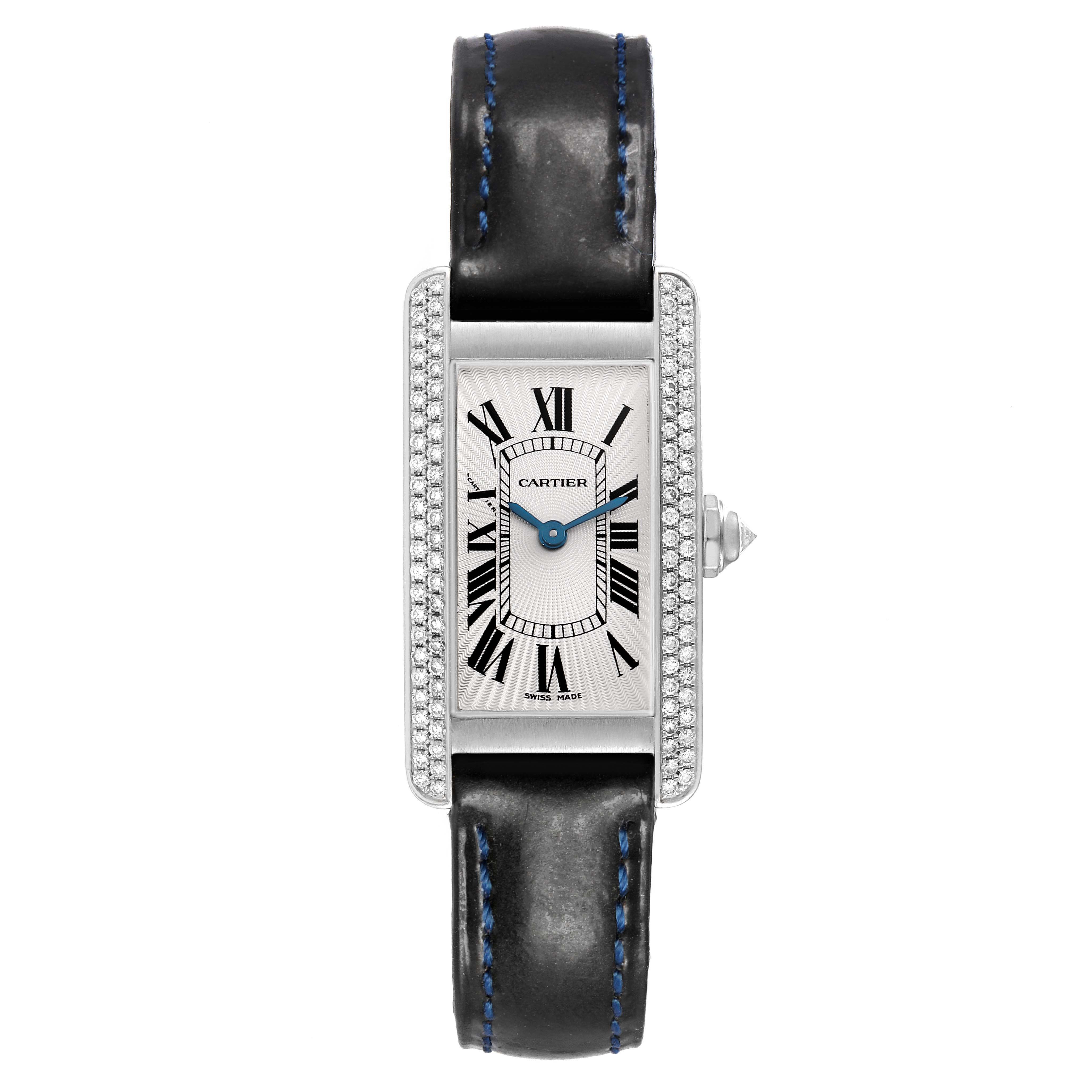 The Cartier Tank Américaine watch is shown from a top-down angle, displaying its face, strap, and diamond-set bezel.
