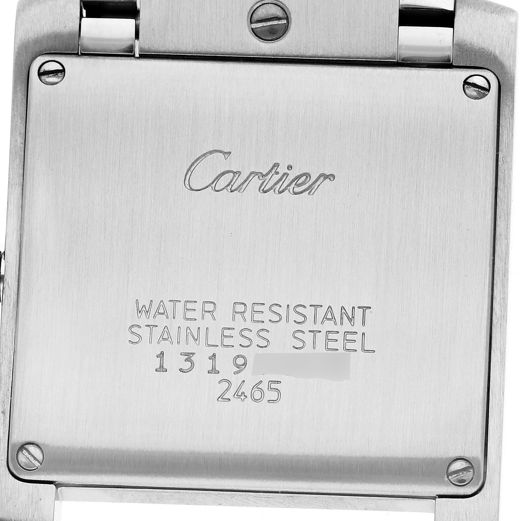 The image shows the back case of the Cartier Tank Française, highlighting the engraved brand and model details.