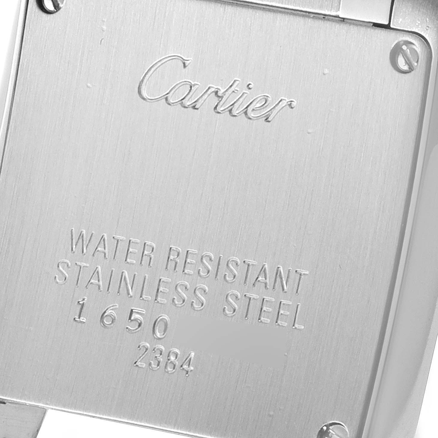 This image shows the back case of a Cartier Tank Francaise W51008Q3 Women's Stainless Steel Silver Dial W51008Q3 Women's Stainless Steel Silver Dial watch, displaying its water resistance and stainless steel marking.