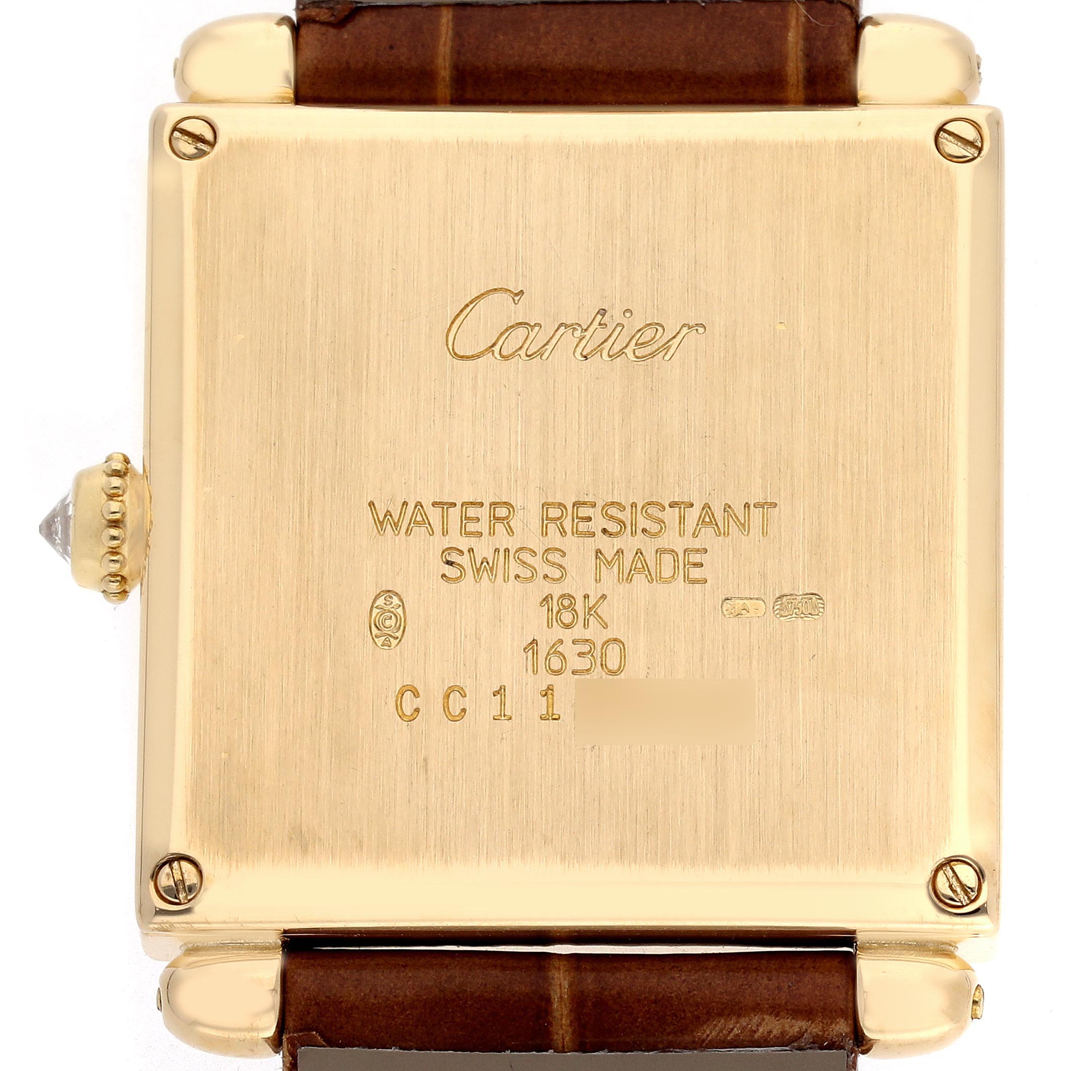 The image shows the back of a Cartier Tank Obus WB800351 Women
s Yellow Gold Silver Dial WB800351 Women
s Yellow Gold Silver Dial watch, highlighting the engraved details and brown strap attachment.