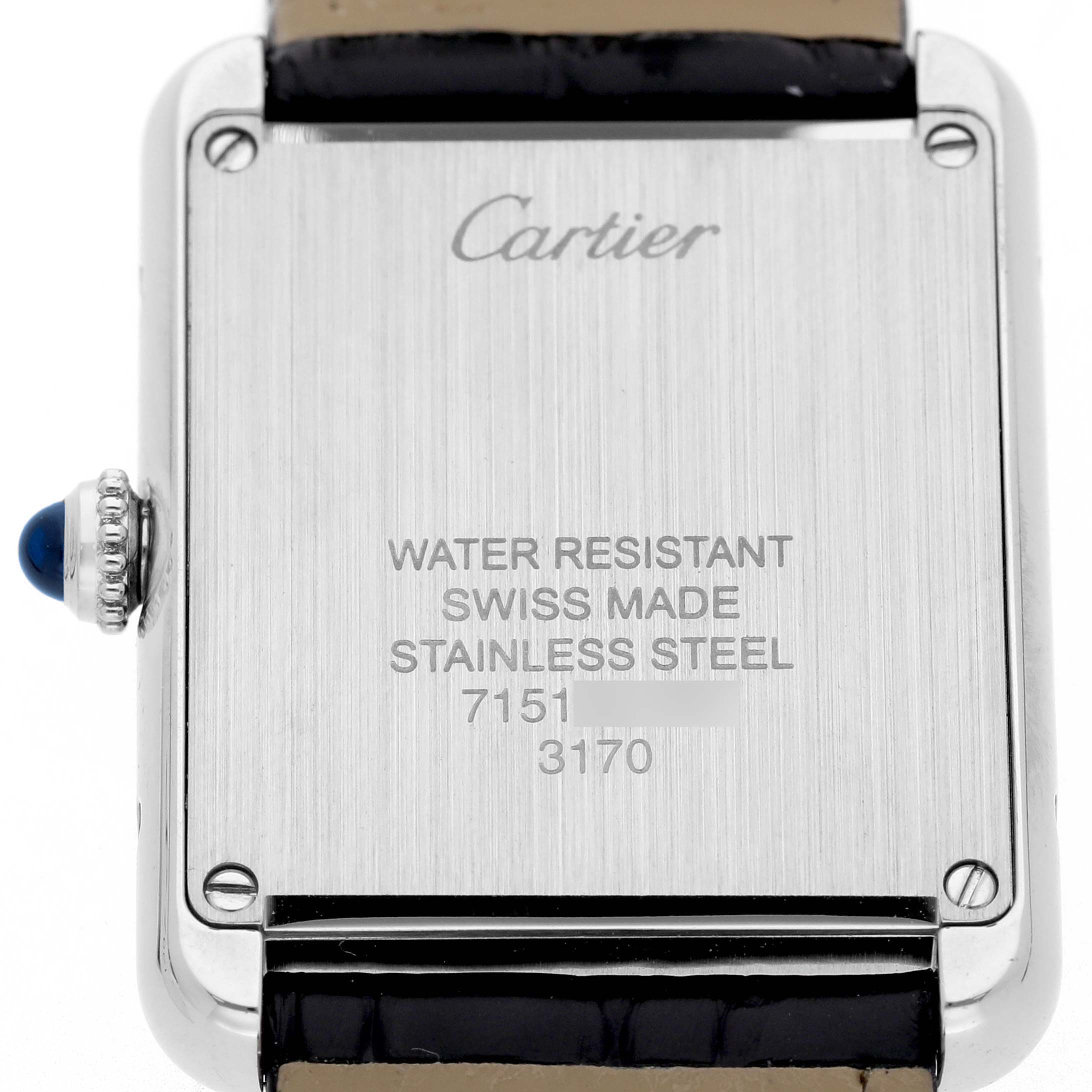 The image shows the back case of a Cartier Tank Solo W5200005 Women's Stainless Steel Silver Dial watch, displaying the brand logo, water resistance info, and a blue cabochon crown.