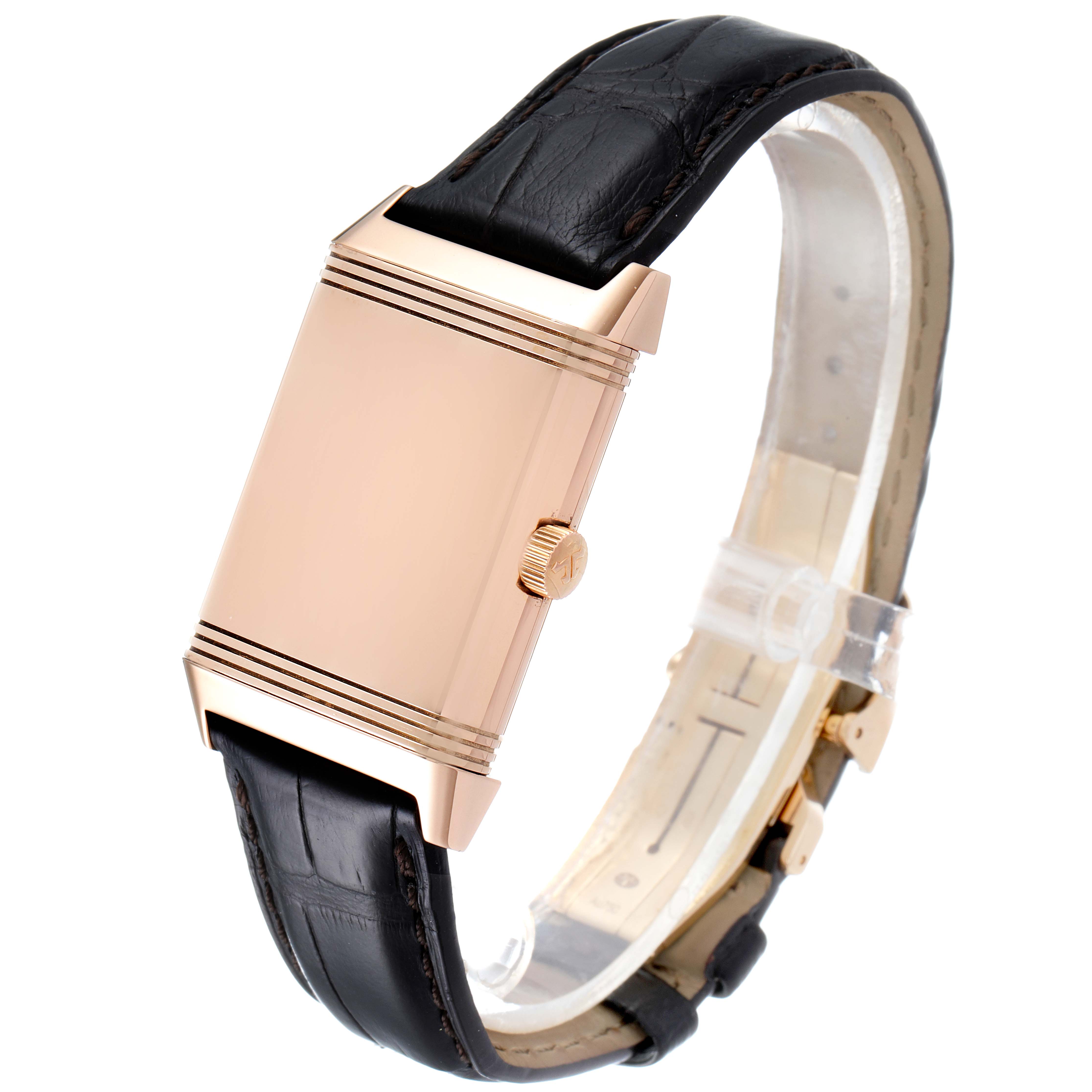 The image shows a Jaeger-LeCoultre Reverso watch displayed from a side angle, highlighting its rose gold case and black leather strap.