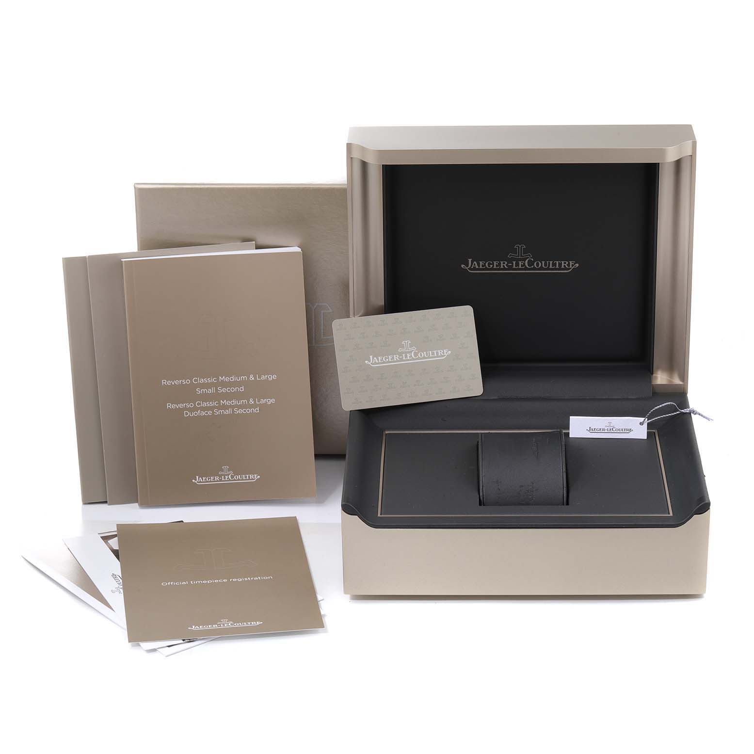 The image shows the packaging, manuals, and accessories of a Jaeger LeCoultre Reverso Q3848420 Men's Stainless Steel Silver Dial Q3848420 Men's Stainless Steel Silver Dial watch.