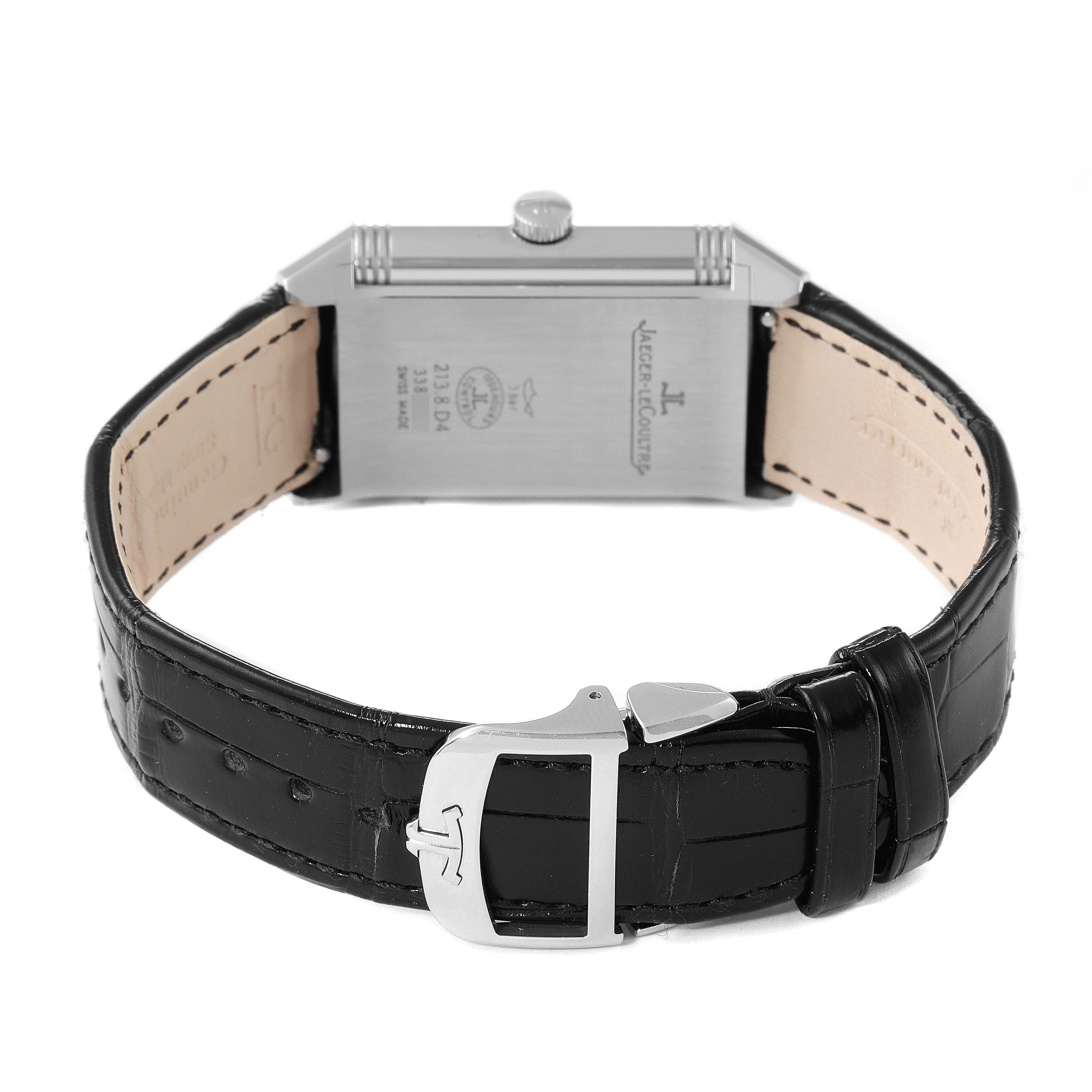 The image shows the back of a Jaeger LeCoultre Reverso Q3848420 Men's Stainless Steel Silver Dial Q3848420 Men's Stainless Steel Silver Dial watch, including the case back, crown, and leather strap with a clasp.