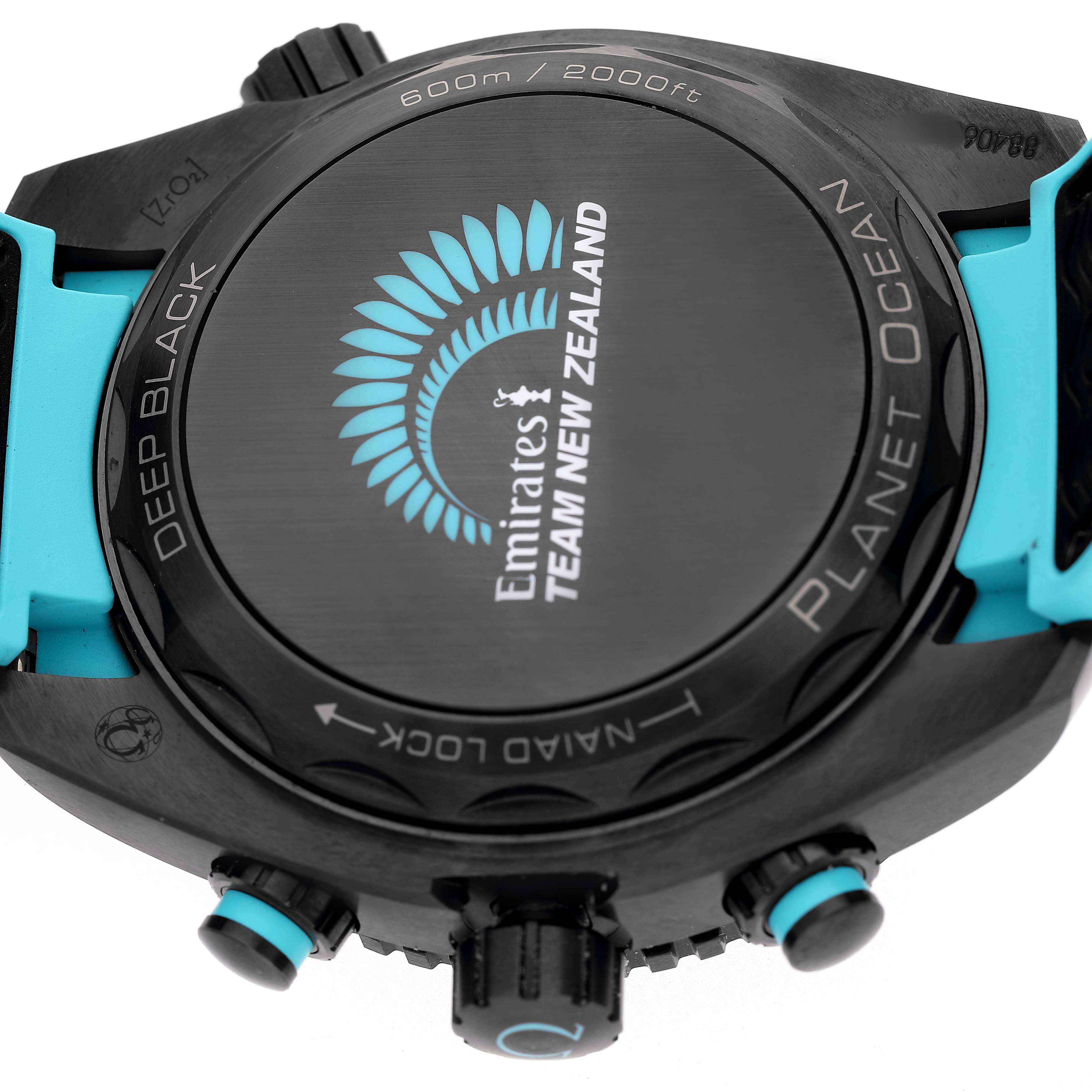 The image shows the back of the Omega Planet Ocean 215.92.46.51.01.003 Men's Ceramic Black Dial watch, featuring branding and a "Deep Black" design.