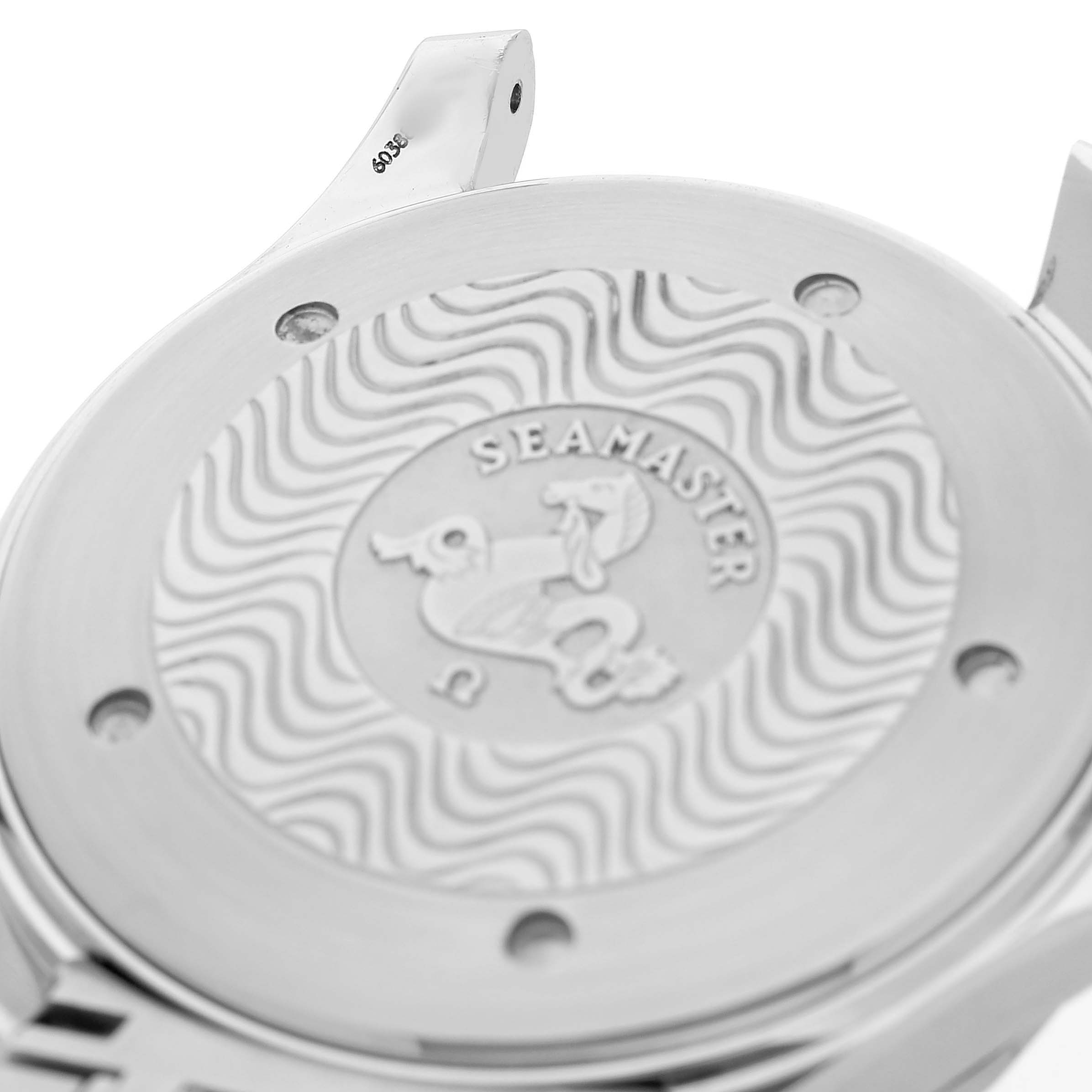 The image shows the back of an Omega Seamaster 2531.80.00 Men's Stainless Steel Blue Dial watch case, highlighting the engraved logo and wave design.