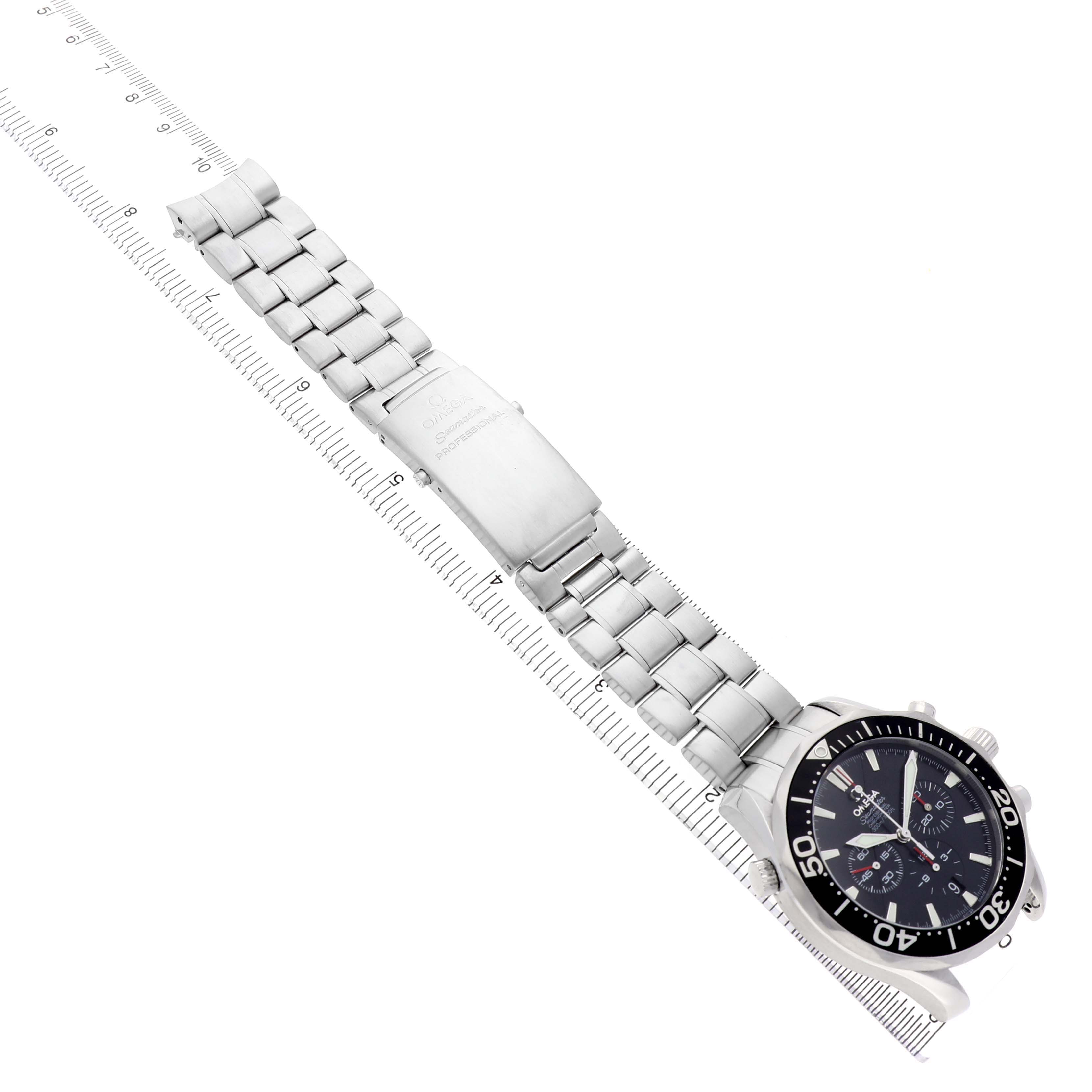 The Omega Seamaster 2594.52.00 Men's Stainless Steel Black Dial watch is shown at an angle displaying the face, bezel, and bracelet alongside a measuring scale.