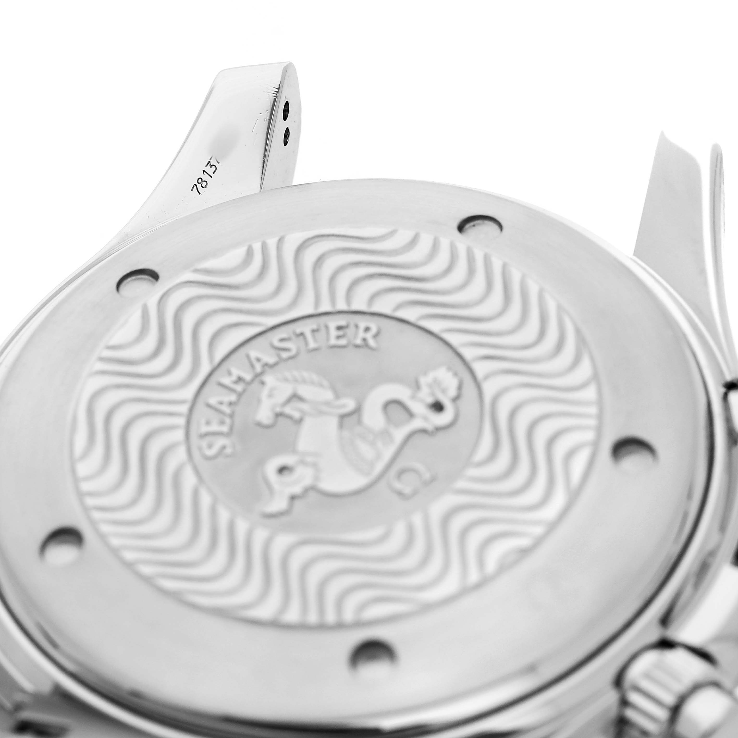 The image shows the engraved back case of an Omega Seamaster 2594.52.00 Men's Stainless Steel Black Dial watch from a side angle, highlighting the design and logo.