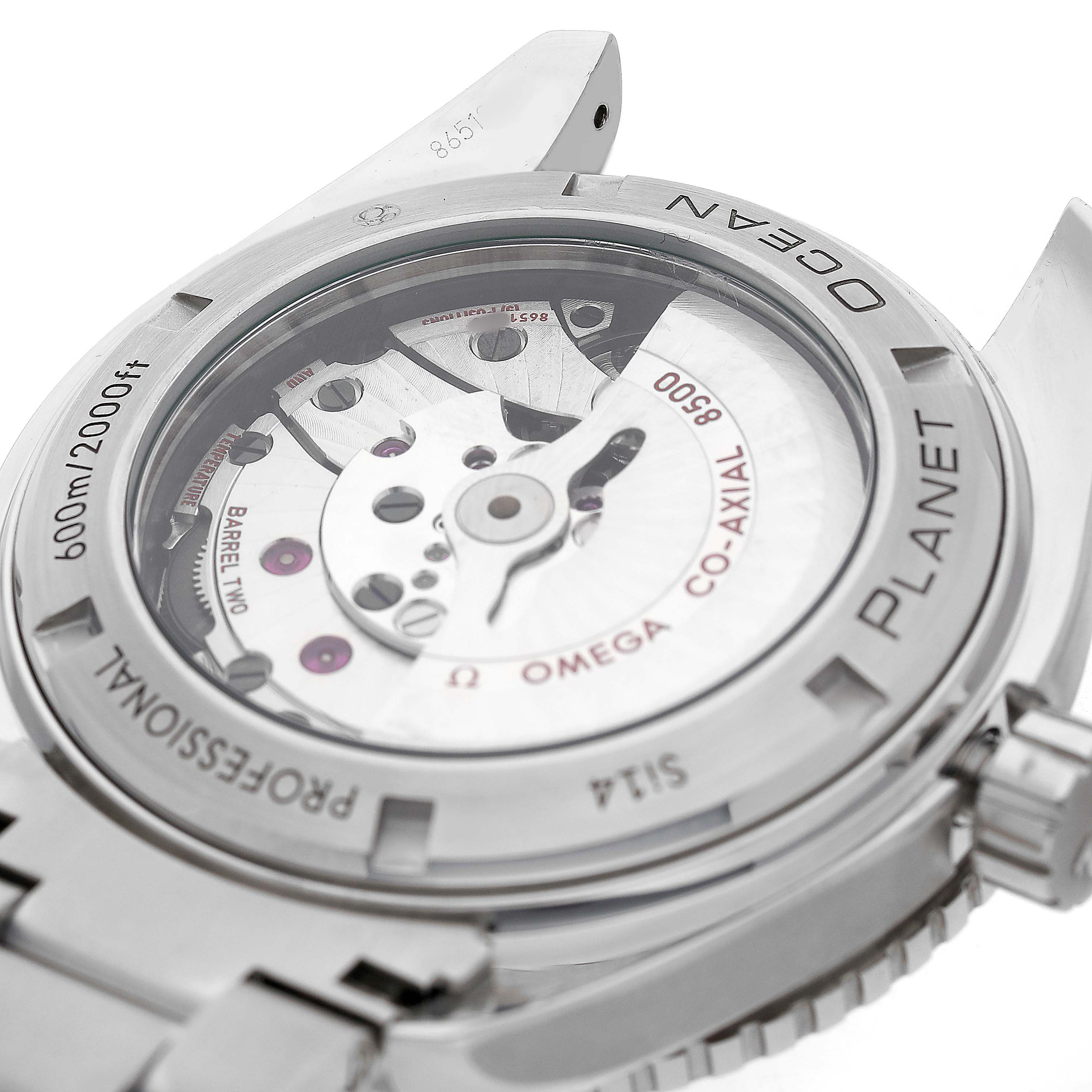The image shows the back view of the Omega Planet Ocean 232.30.46.21.01.003 Men's Stainless Steel Black Dial watch, highlighting the movement and case details.