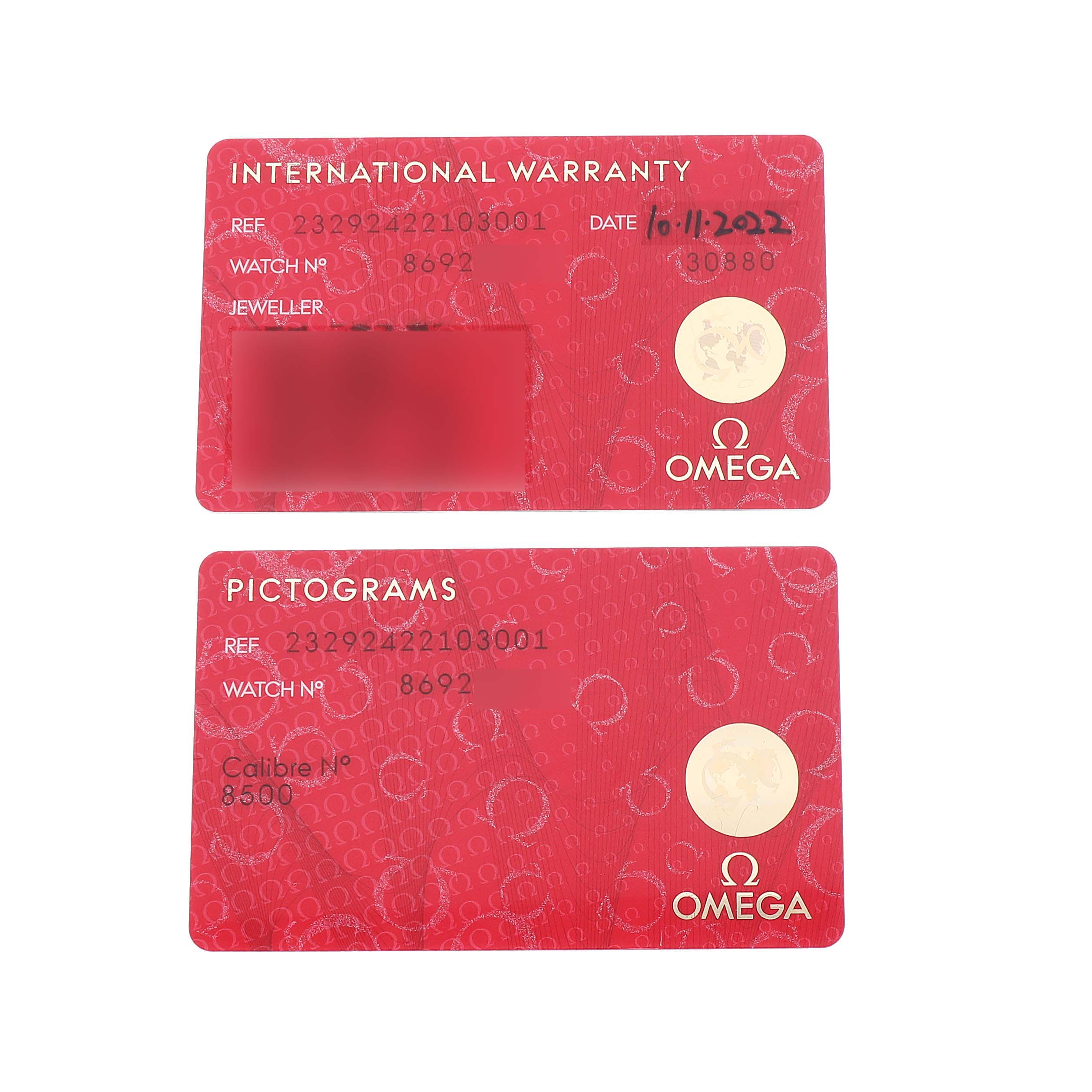 This image shows the warranty and pictogram cards for an Omega Planet Ocean 232.92.42.21.03.001 Men's Titanium Blue Dial watch, viewed from above.