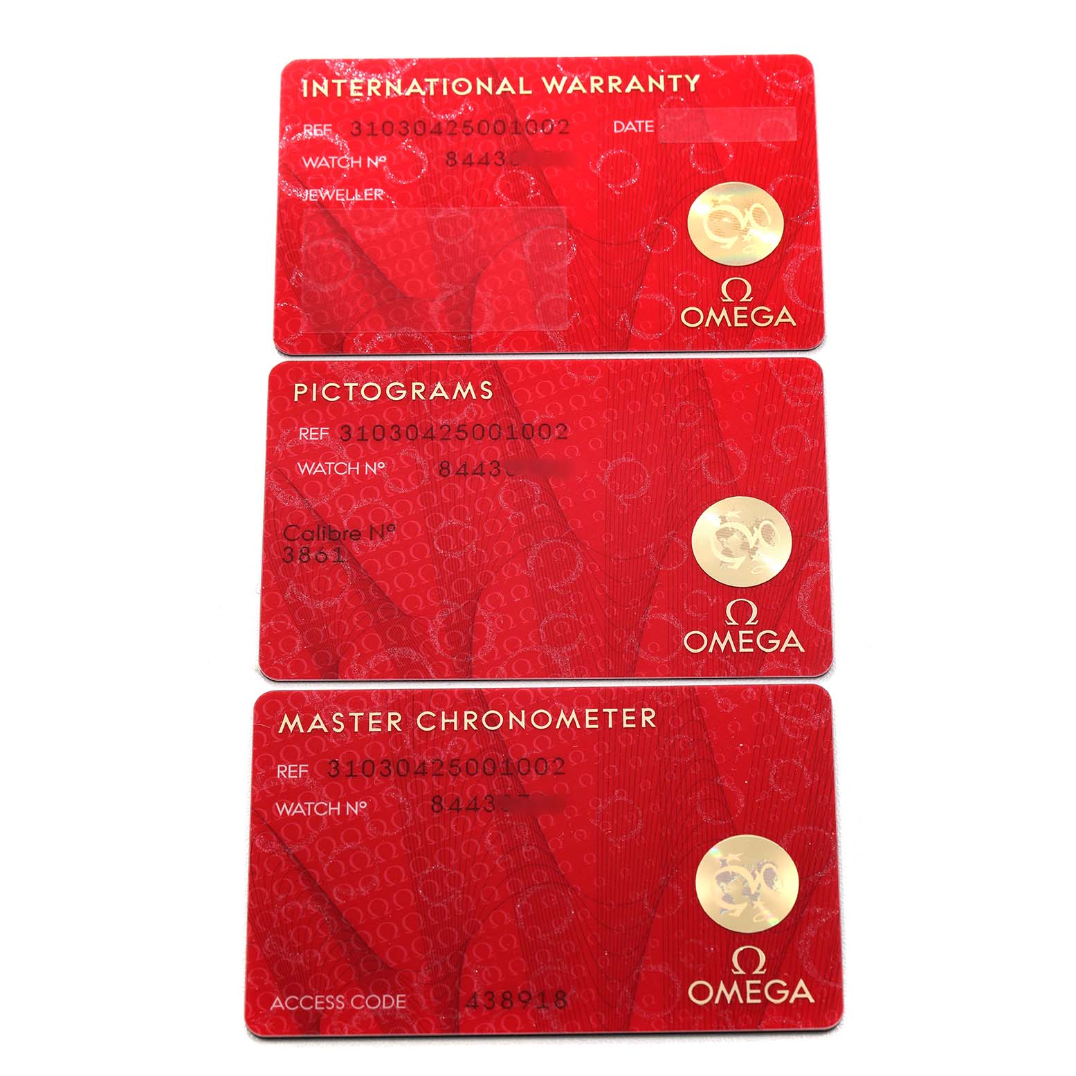 The image shows three red cards for the Omega Speedmaster 310.30.42.50.01.002 Men's Stainless Steel Black Dial: International Warranty, Pictograms, and Master Chronometer.