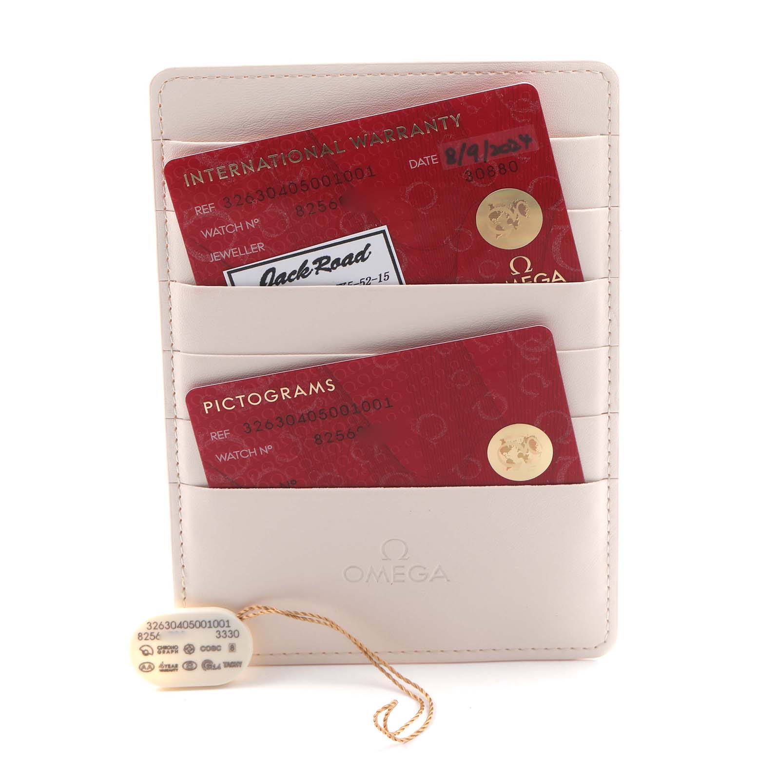 The image shows warranty and pictogram cards for the Omega Speedmaster 326.30.40.50.01.001 Men
s Stainless Steel Black Dial 326.30.40.50.01.001 Men
s Stainless Steel Black Dial, neatly placed in a branded cardholder.