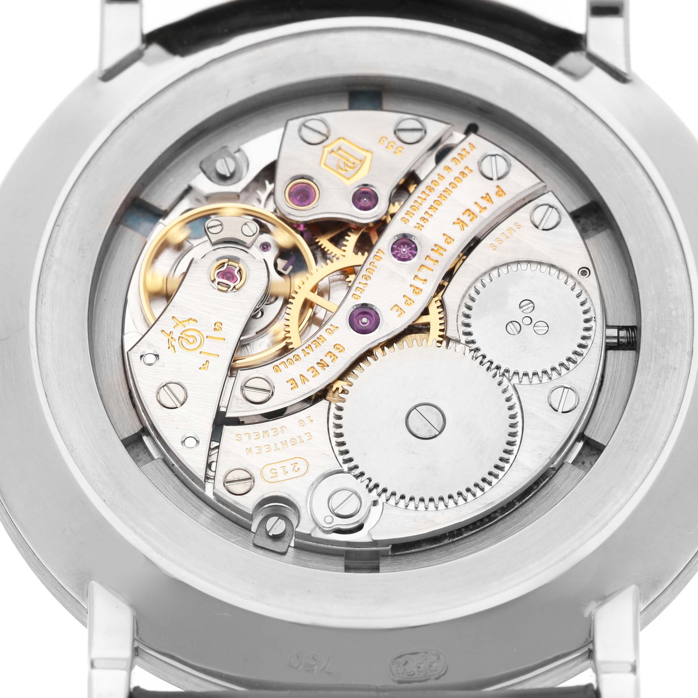 The image shows the case back of the Patek Philippe Calatrava 5116 Men's White Gold White Dial, highlighting its intricate mechanical movement.