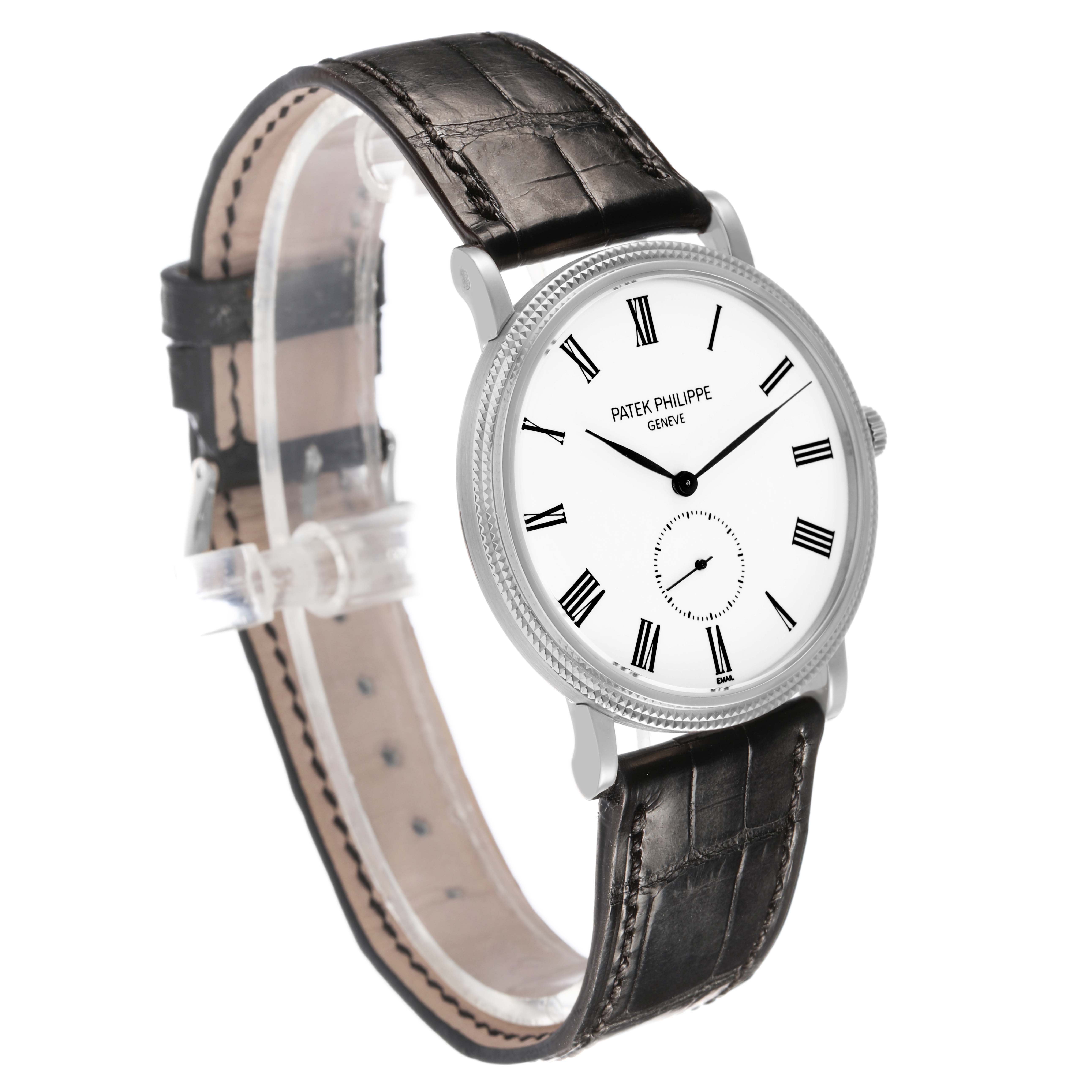 The Patek Philippe Calatrava 5116 Men's White Gold White Dial watch is shown at a three-quarter angle, displaying the face, strap, and side view.