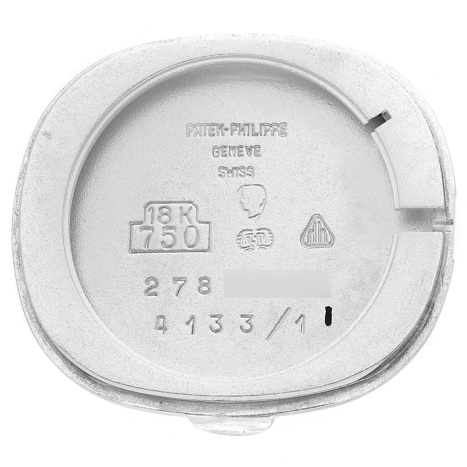 This image shows the back case of a Patek Philippe Golden Ellipse 4133 Women's White Gold White Dial 4133 Women's White Gold White Dial watch, displaying its engravings and hallmarks.