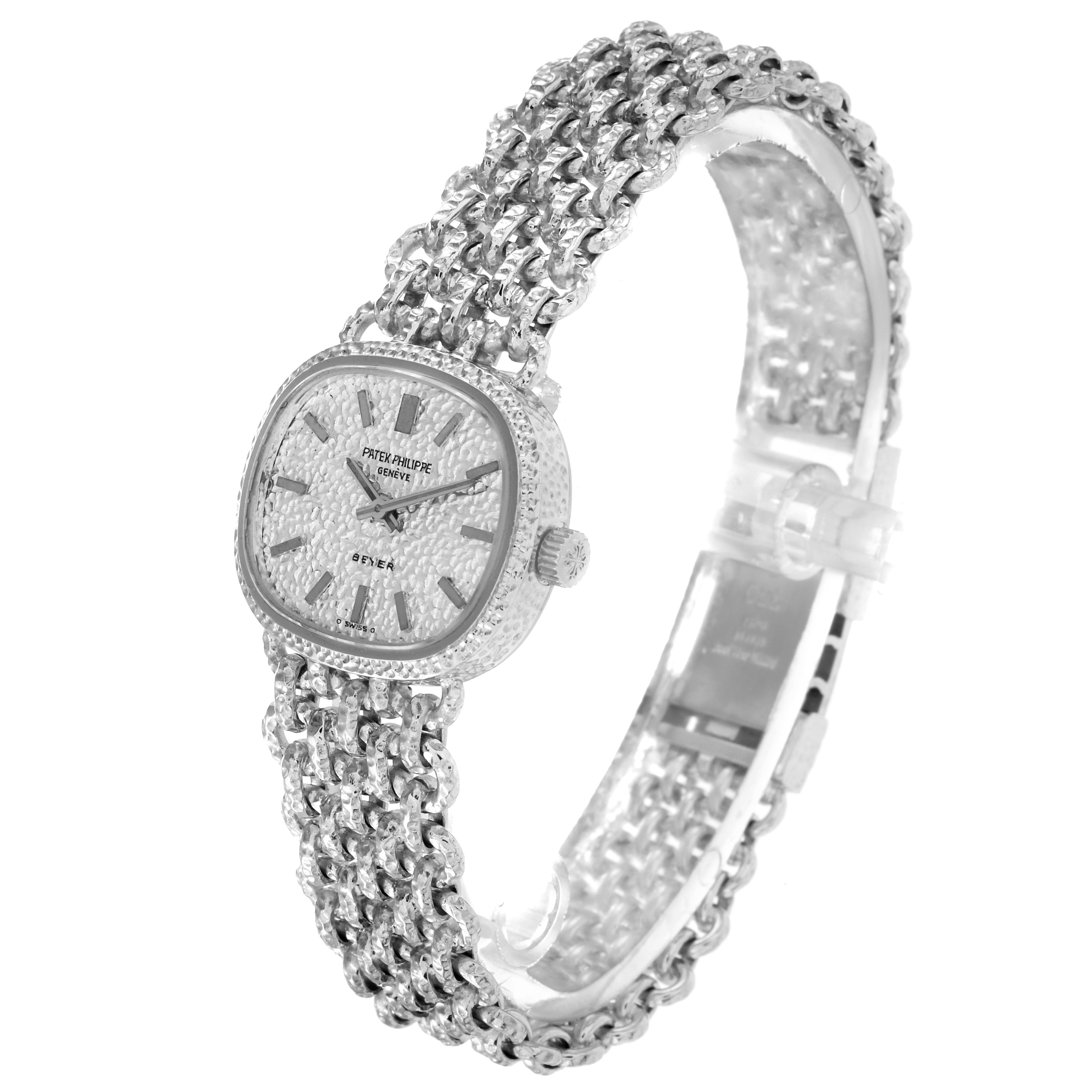 The image shows a Patek Philippe Golden Ellipse 4133 Women's White Gold White Dial 4133 Women's White Gold White Dial watch at a three-quarter angle, highlighting its textured dial and intricate bracelet.