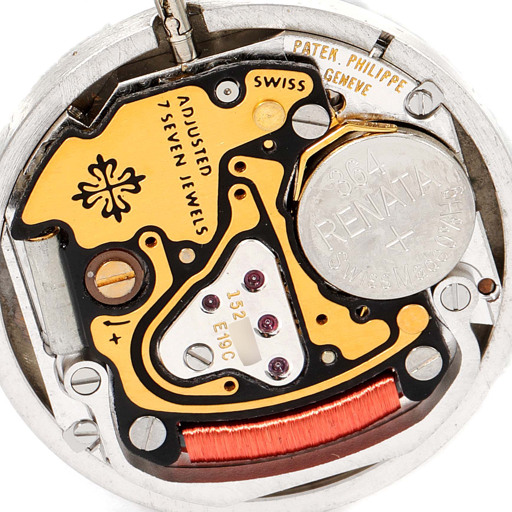 This close-up image shows the inner mechanical components of a Patek Philippe Nautilus 4700/G Women's Yellow Gold Black Dial 4700/G Women's Yellow Gold Black Dial watch.