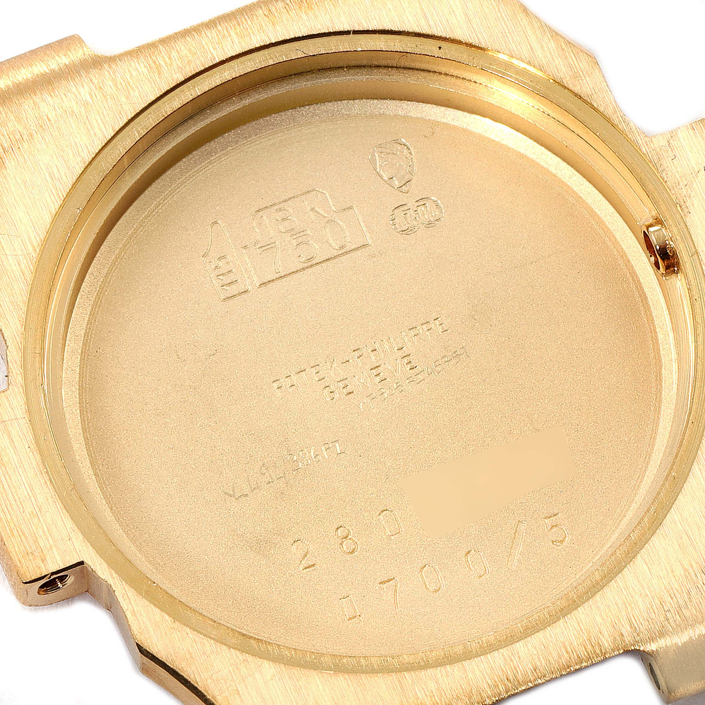 This image shows the inside case back of a Patek Philippe Nautilus 4700/G Women's Yellow Gold Black Dial 4700/G Women's Yellow Gold Black Dial watch viewed from above.