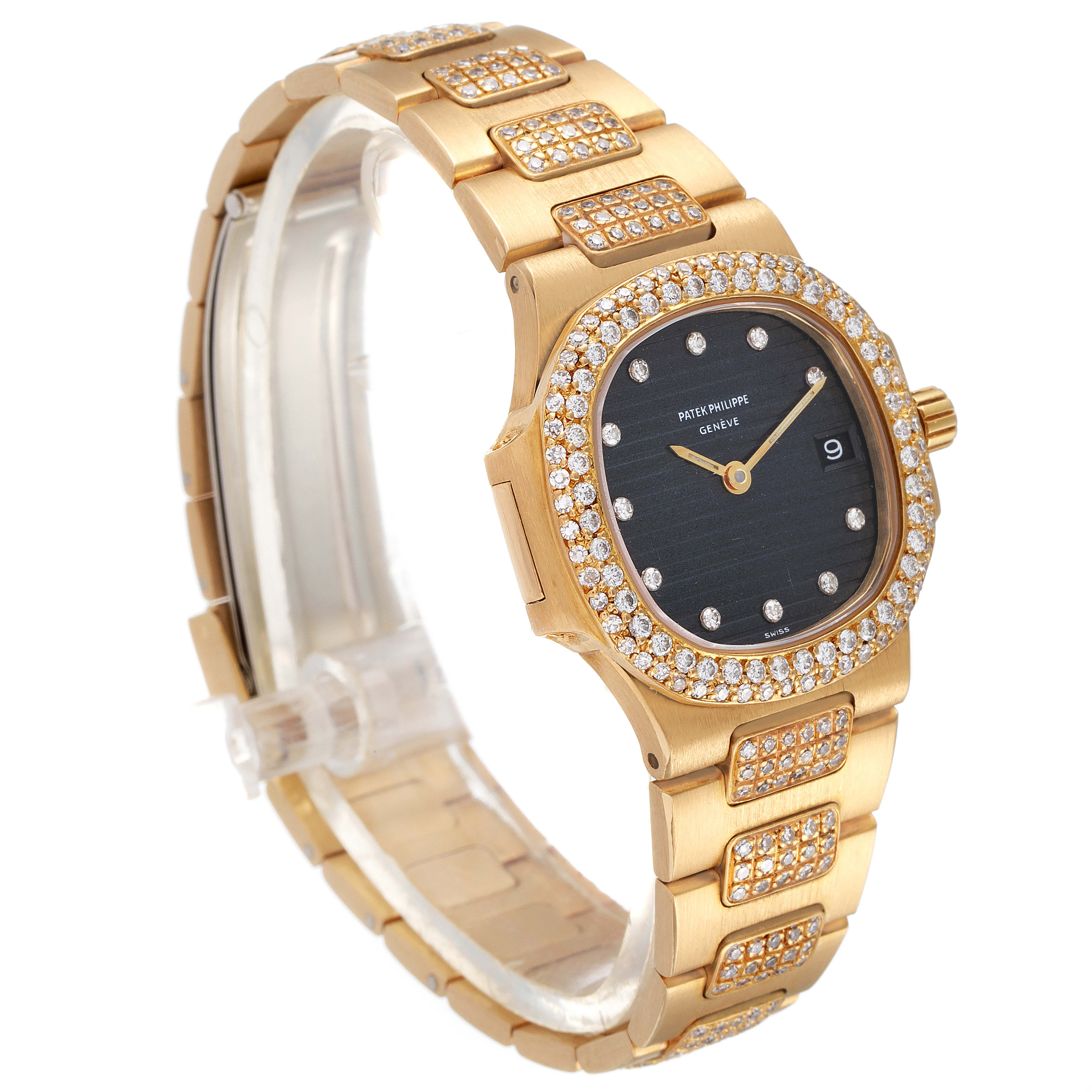 The image shows a side angle of the Patek Philippe Nautilus 4700/G Women's Yellow Gold Black Dial 4700/G Women's Yellow Gold Black Dial watch, highlighting its gold case, diamond bezel, and bracelet.