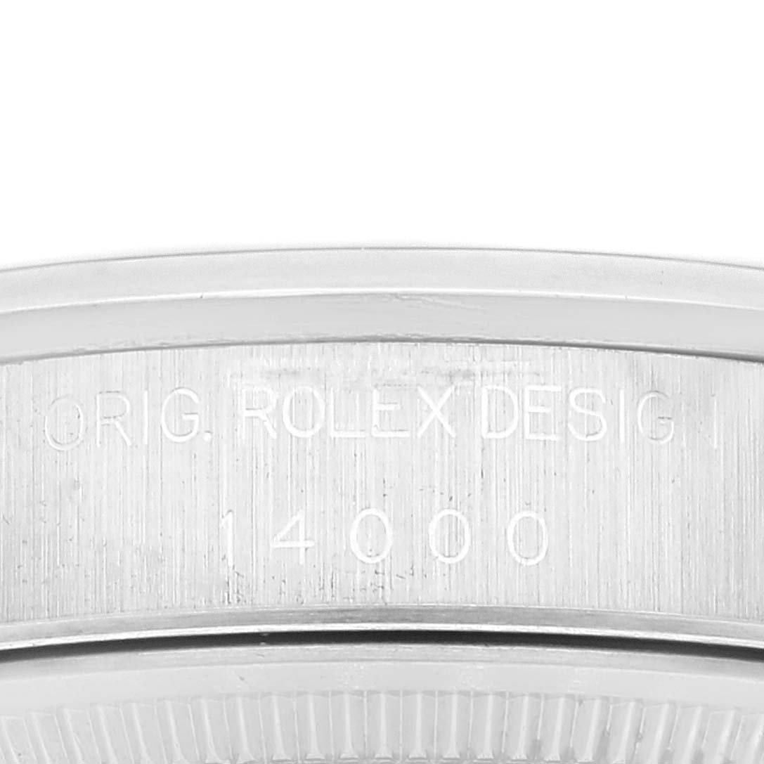 This close-up angle shows the engraving on the side of the case for the Rolex Air-King 14000 Men's Stainless Steel White Dial 14000 Men's Stainless Steel White Dial model 14000.