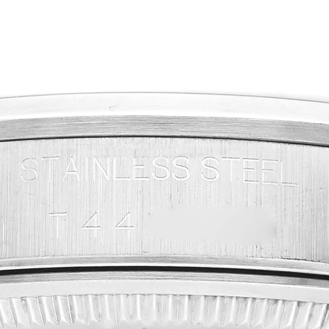 This image shows a close-up view of the rim and engravings on the case back of a Rolex Air-King 14000 Men's Stainless Steel White Dial 14000 Men's Stainless Steel White Dial watch.