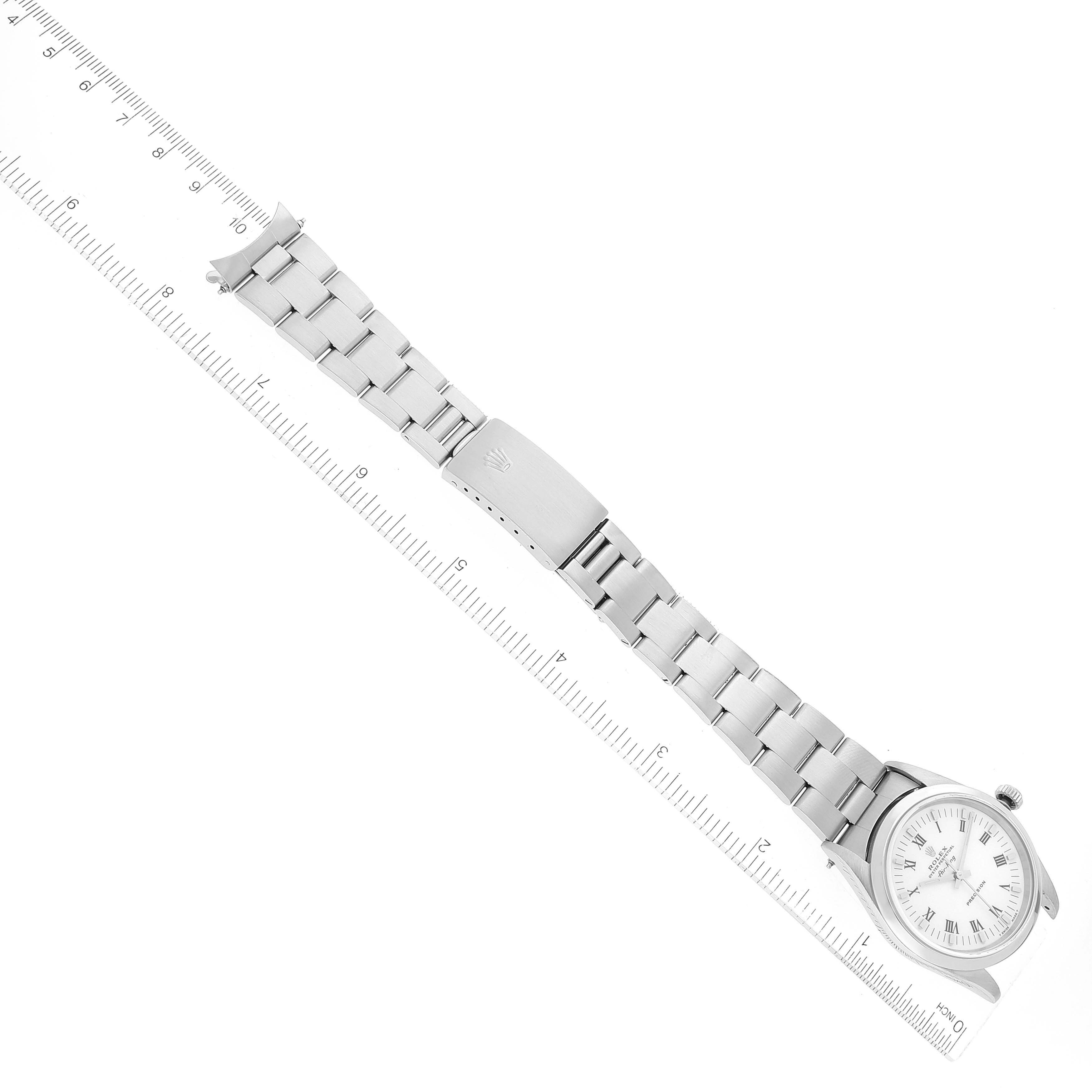 The Rolex Air-King 14000 Men's Stainless Steel White Dial 14000 Men's Stainless Steel White Dial watch is shown flat with its full bracelet and clasp visible, positioned next to a ruler for scale.