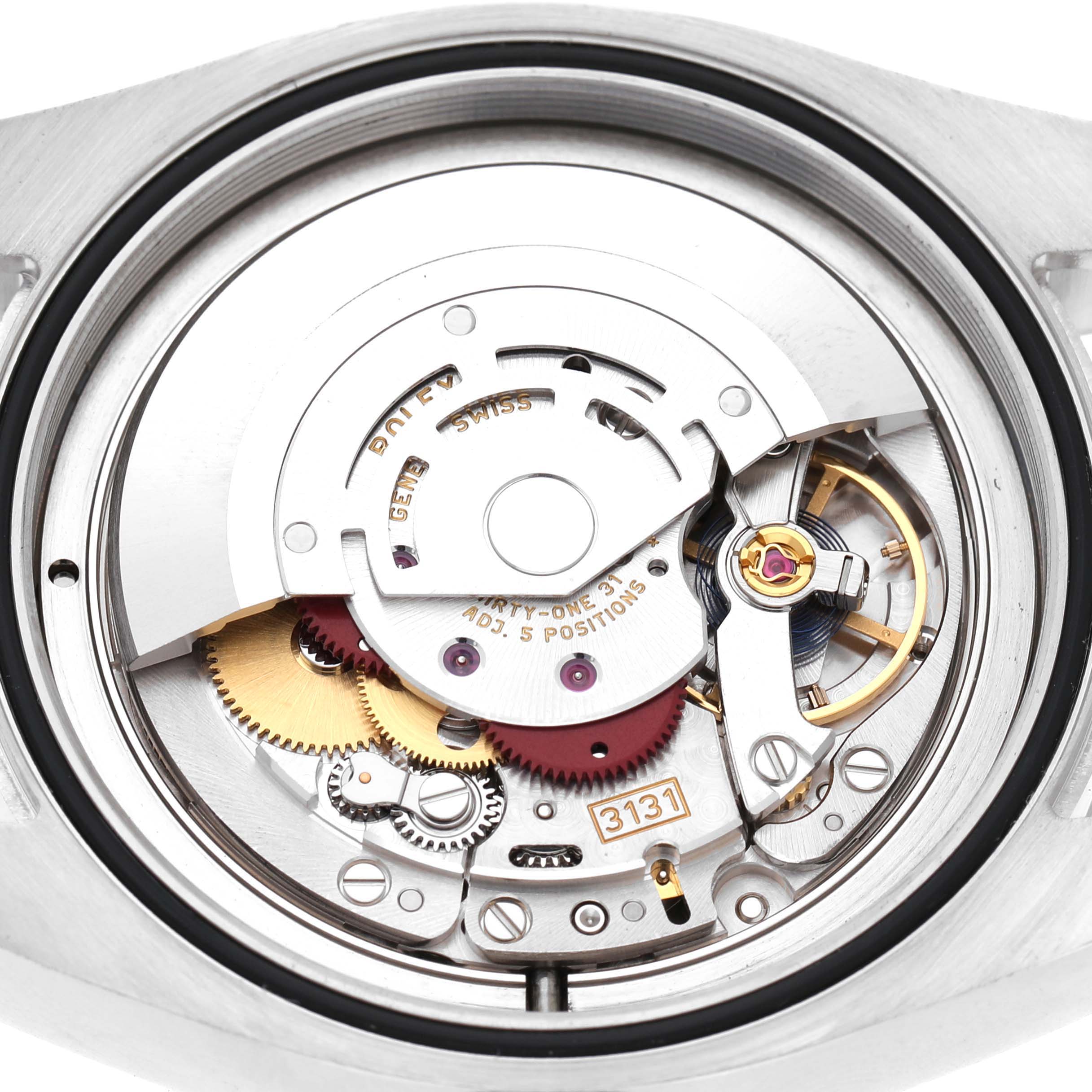 The image shows the Rolex Air-King 116900 Men's Stainless Steel Black Dial watch from a top-down angle, highlighting its movement and intricate internal components.