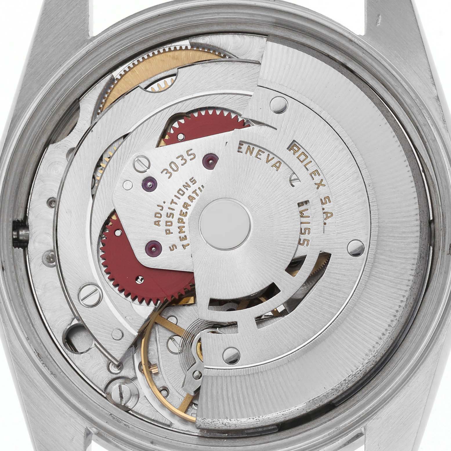 The image shows the movement of a Rolex Date 15010 Men's Stainless Steel Silver Dial 15010 Men's Stainless Steel Silver Dial model from a rear angle, highlighting gears and rotors.