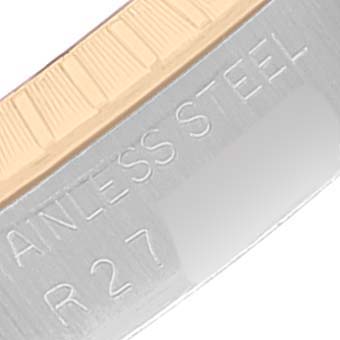 Close-up view of a Rolex Date 15053 Men's Steel and Gold (two tone) Champagne Dial 15053 Men's Steel and Gold (two tone) Champagne Dial model watch, showing part of the stainless steel casing.