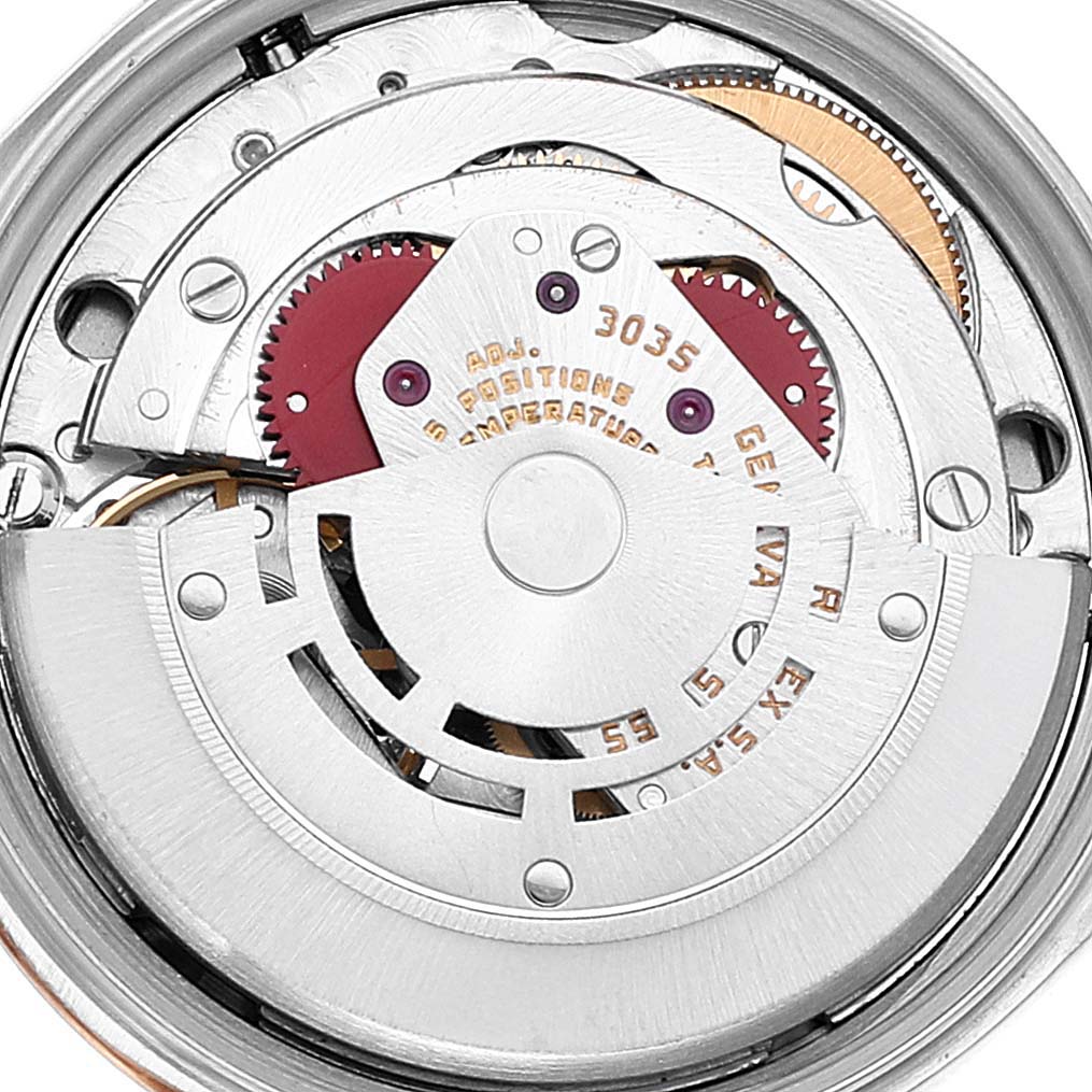 Close-up of the inner mechanical movement of a Rolex Date 15053 Men's Steel and Gold (two tone) Champagne Dial 15053 Men's Steel and Gold (two tone) Champagne Dial model, showing gears, rotor, and other intricate components.