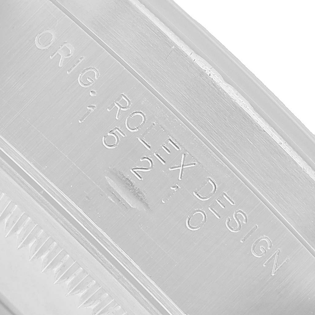 The image shows an engraved view of the case side of a Rolex Date 15210 Men's Stainless Steel Blue Dial watch, highlighting the model number 15210.