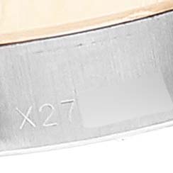 This close-up image shows a portion of the bezel and the case with an engraving on the Rolex Datejust 69173 Women's Steel and Gold (two tone) White Dial 69173 Women's Steel and Gold (two tone) White Dial watch.