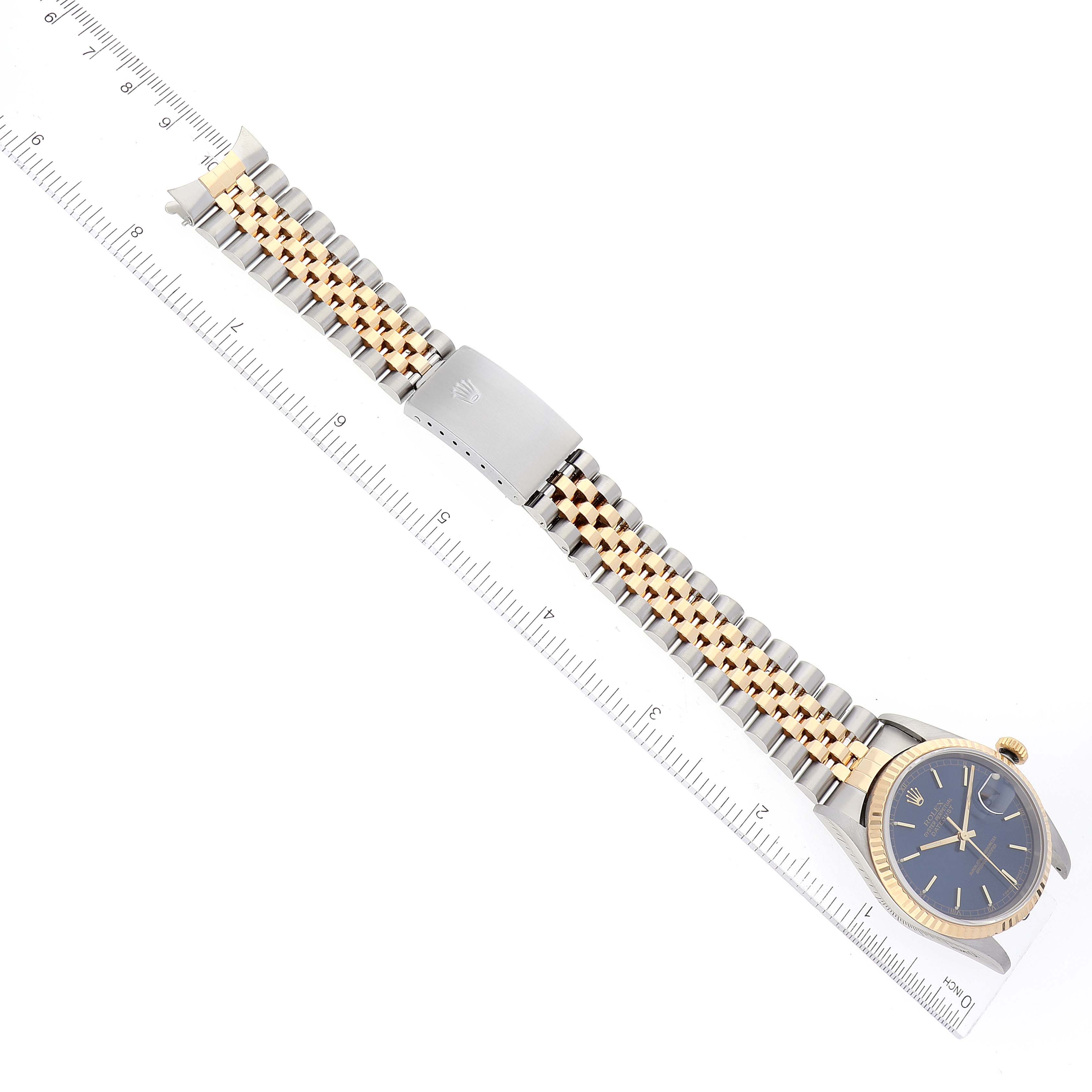 The Rolex Datejust 16233 Men's Steel and Gold (two tone) Blue Dial 16233 Men's Steel and Gold (two tone) Blue Dial watch is shown from a top-down angle, displaying the face, bezel, bracelet, and clasp.