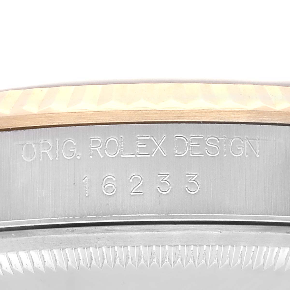 This image shows a close-up of the model number and bezel edge of a Rolex Datejust 16233 Men's Steel and Gold (two tone) Blue Dial 16233 Men's Steel and Gold (two tone) Blue Dial watch.