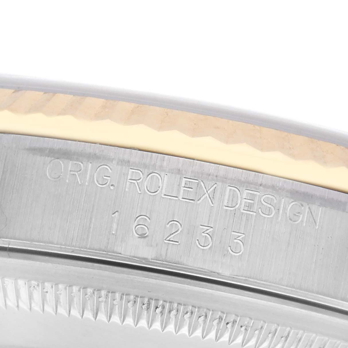 The image shows the side engraving on the case of a Rolex Datejust 16233 Men
s Steel and Gold (two tone) White Dial 16233 Men
s Steel and Gold (two tone) White Dial watch.