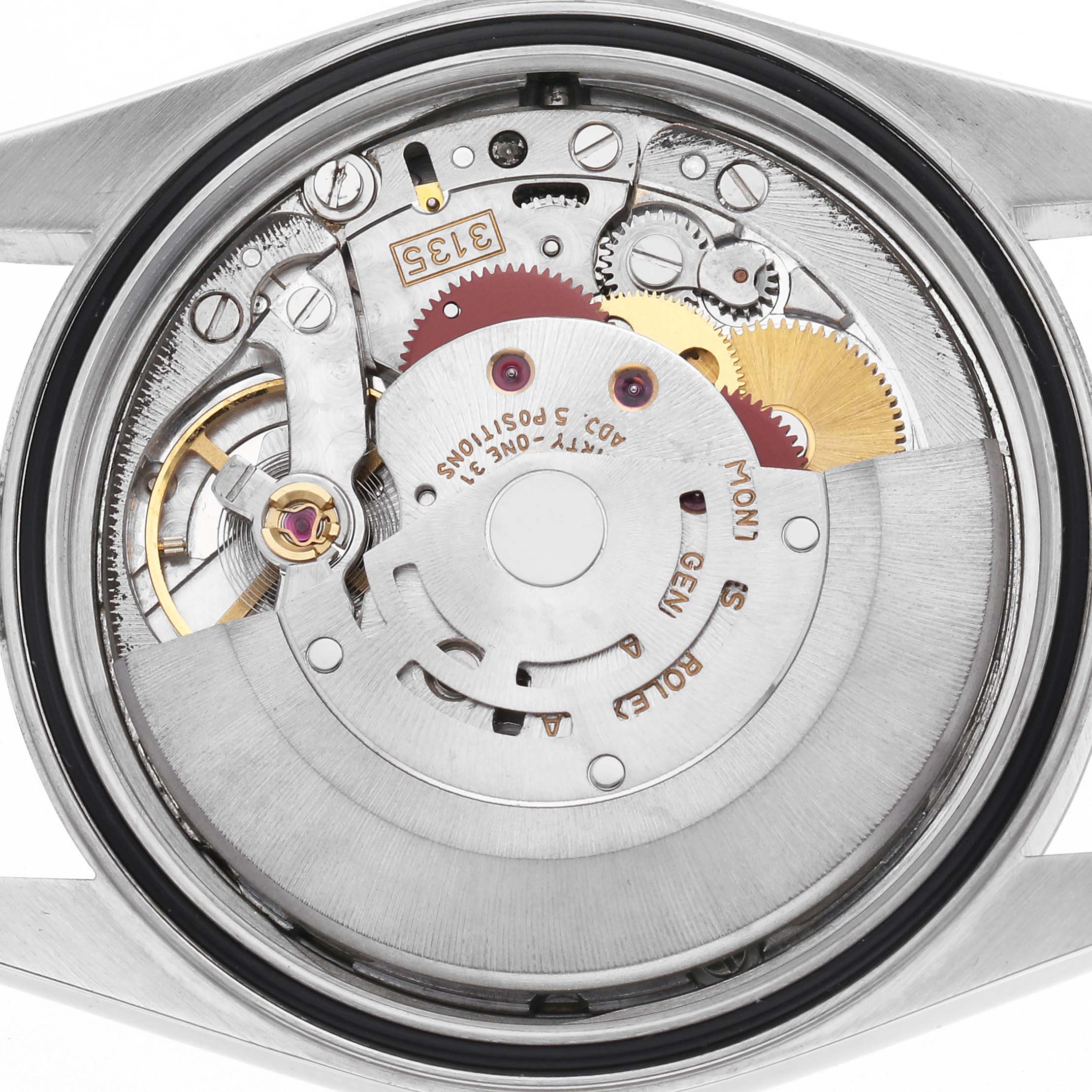 The image shows the movement of a Rolex Datejust 16233 Men
s Steel and Gold (two tone) White Dial 16233 Men
s Steel and Gold (two tone) White Dial watch from a rear angle, highlighting its intricate mechanical components.