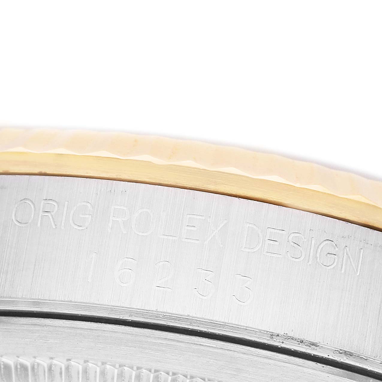 The image shows the side of a Rolex Datejust 16233 Men's Steel and Gold (two tone) White Dial watch's case, highlighting its engraved design and reference number.