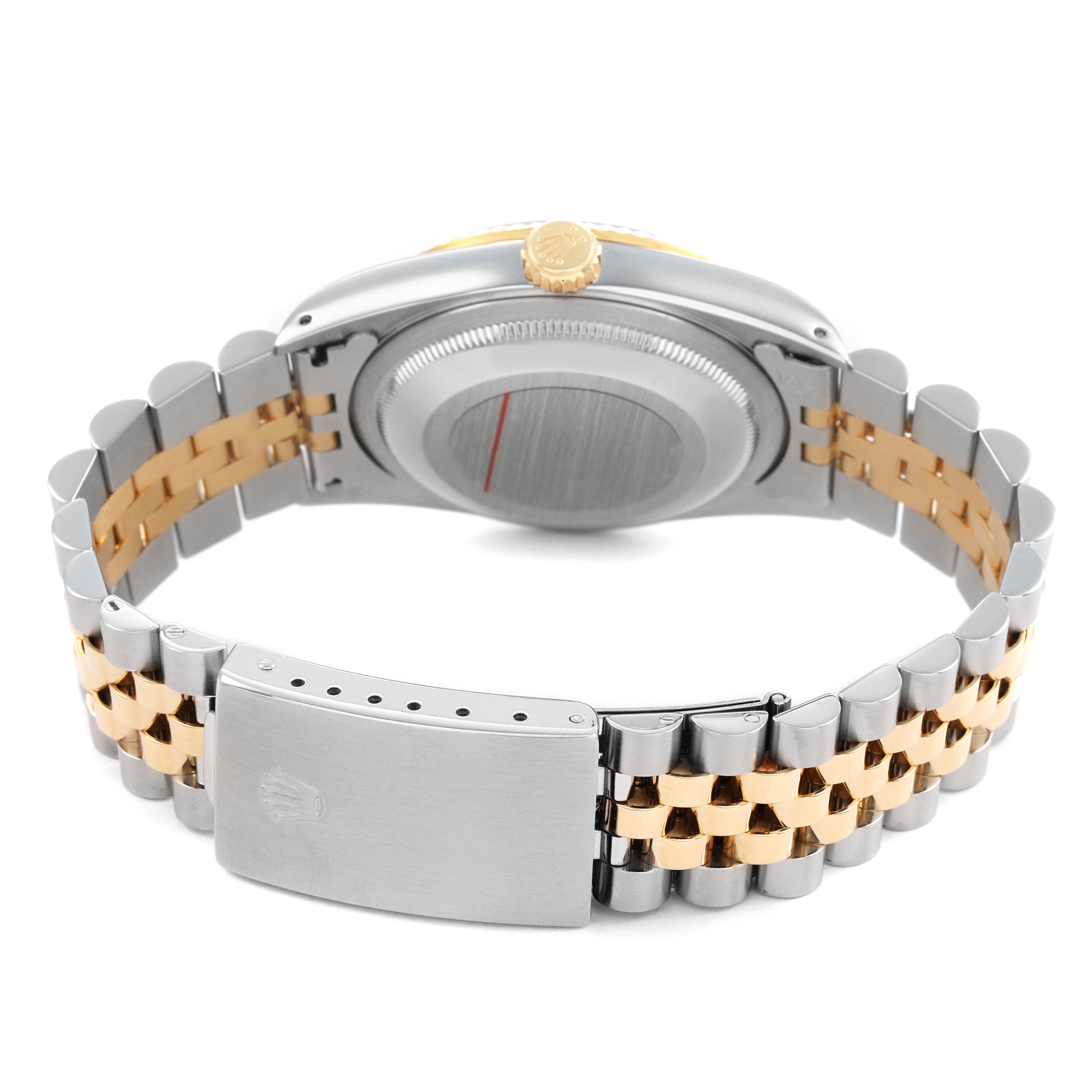 The image displays the underside of a Rolex Datejust 16233 Men's Steel and Gold (two tone) White Dial watch, showcasing the jubilee bracelet and clasp.
