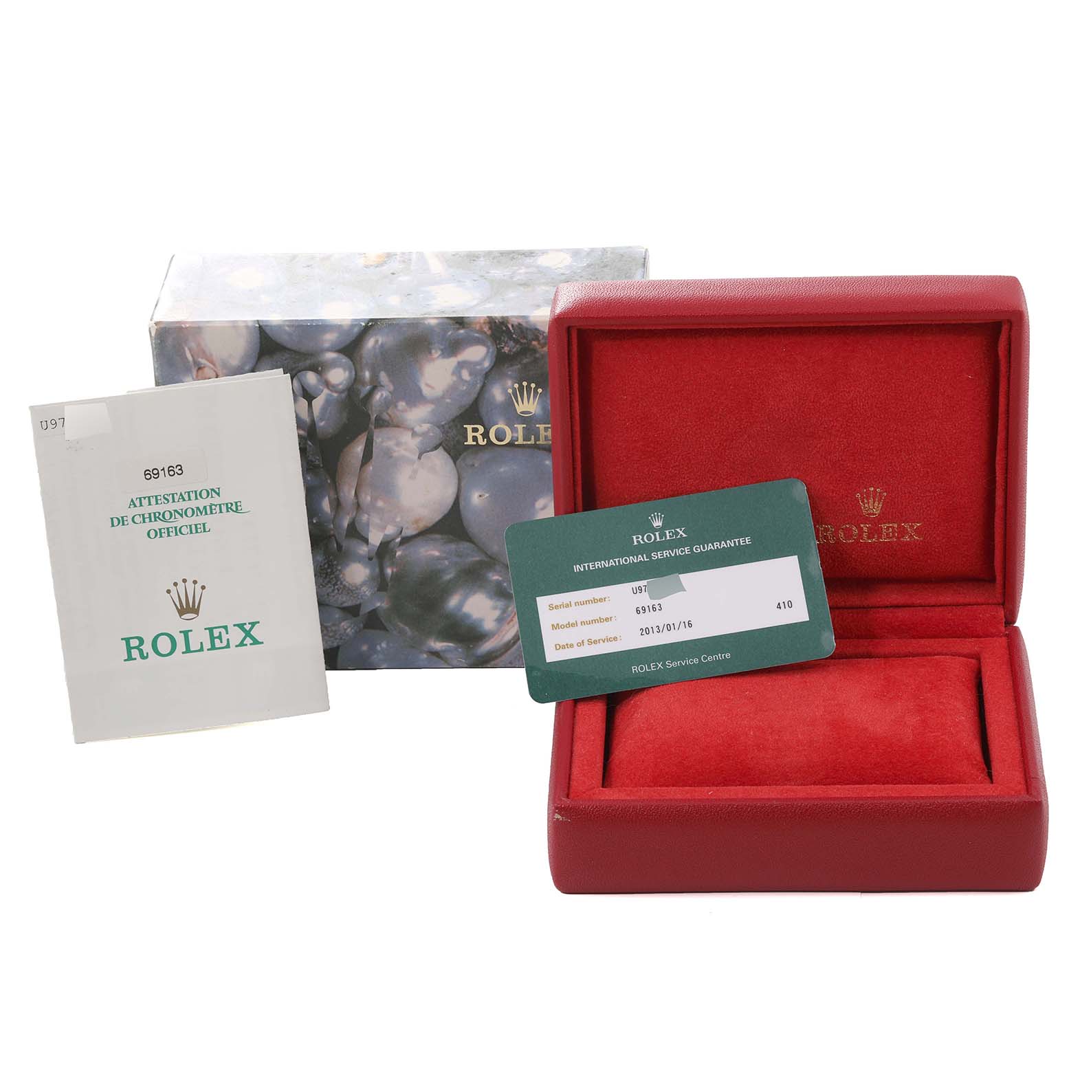 The image shows a Rolex Datejust 69163 Women's Steel and Gold (two tone) Black Dial 69163 Women's Steel and Gold (two tone) Black Dial watch box, an authenticity booklet, and an international service guarantee card.