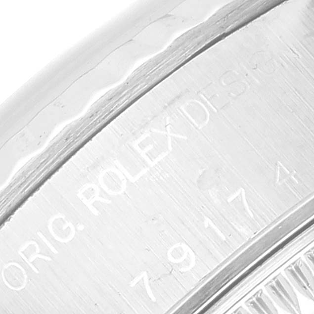 This image shows a close-up of the engraved case back of a Rolex Datejust 79174 Women's Stainless Steel Mother of Pearl Dial 79174 Women's Stainless Steel Mother of Pearl Dial watch.