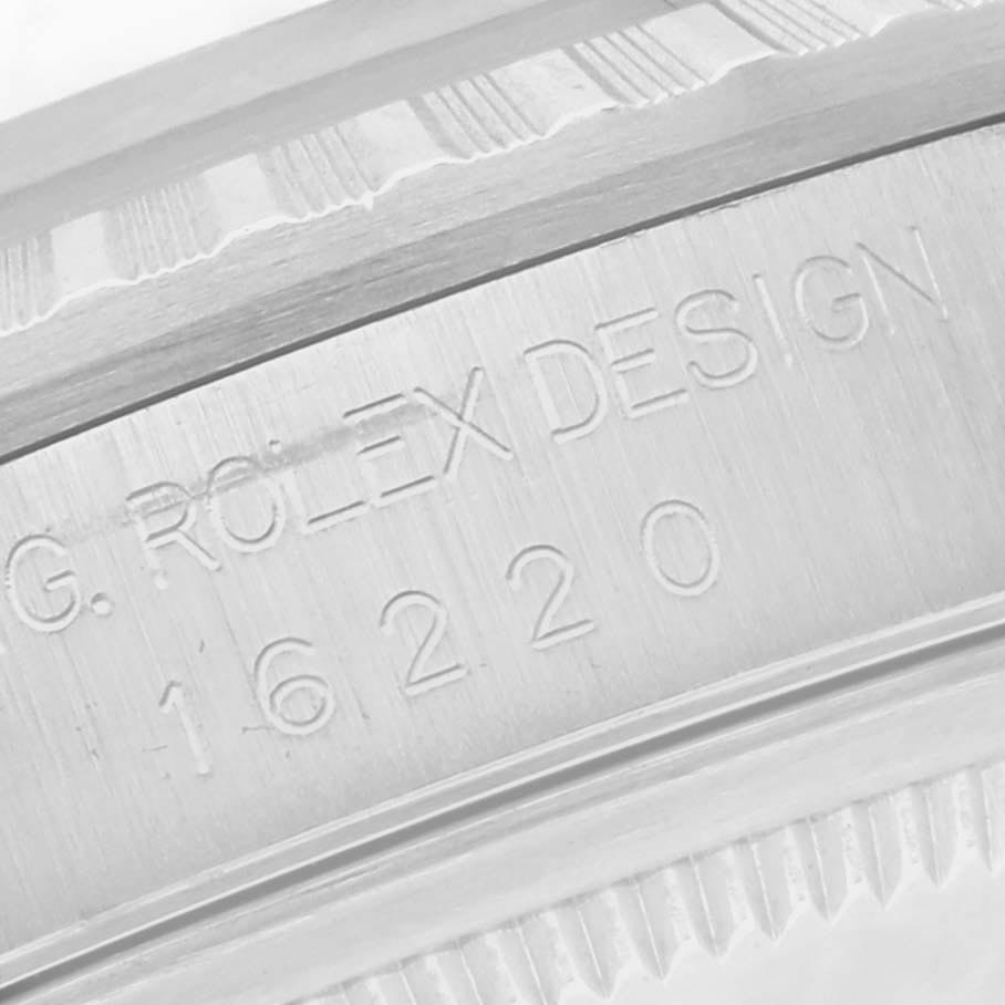The image shows a close-up of the inner bezel of a Rolex Datejust 16220 Men
s Stainless Steel Black Dial 16220 Men
s Stainless Steel Black Dial, highlighting the engraved "ROLEX DESIGN" and model number.