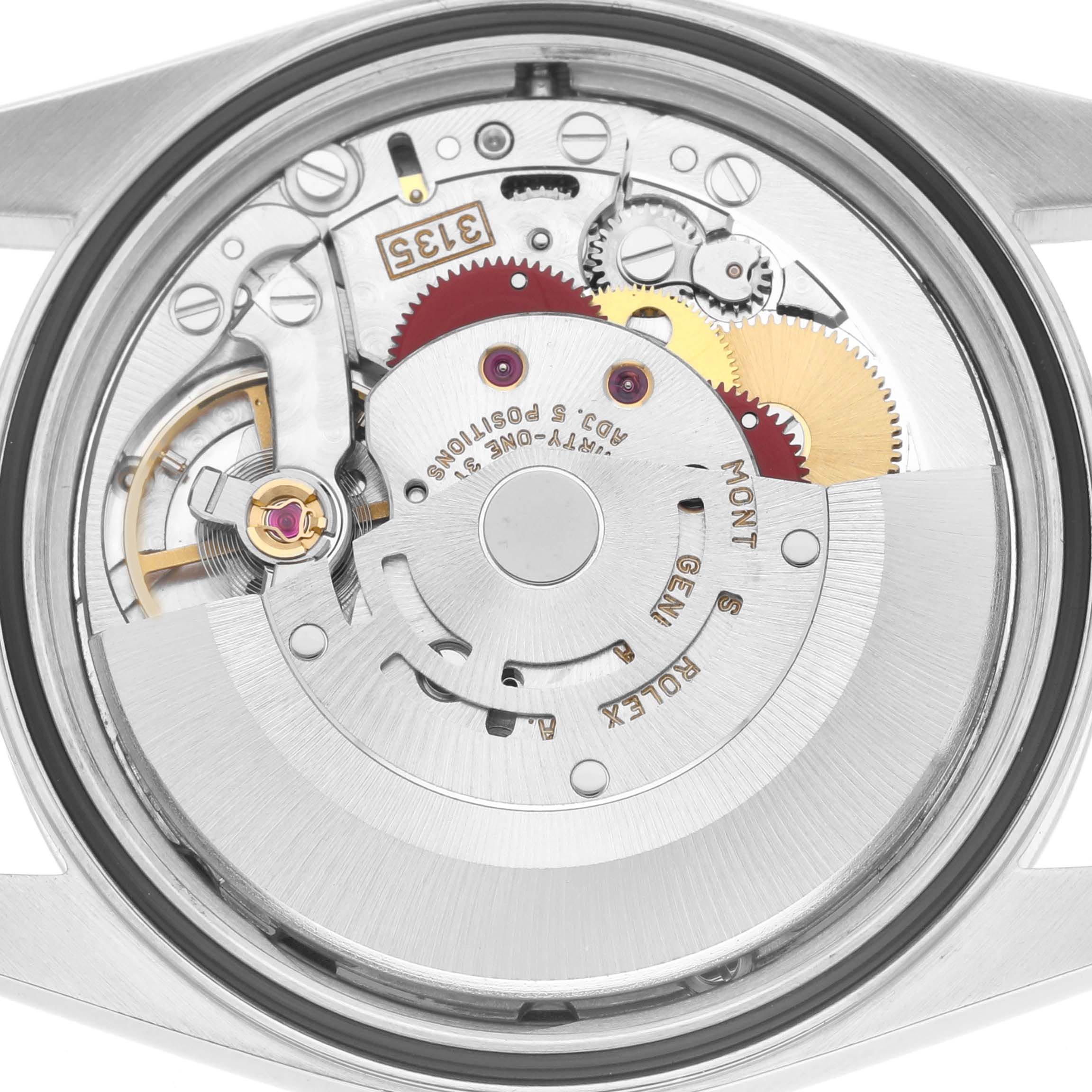 The image shows the movement of a Rolex Datejust 16220 Men
s Stainless Steel Black Dial 16220 Men
s Stainless Steel Black Dial watch from a top-down angle, revealing the intricate gears and components.