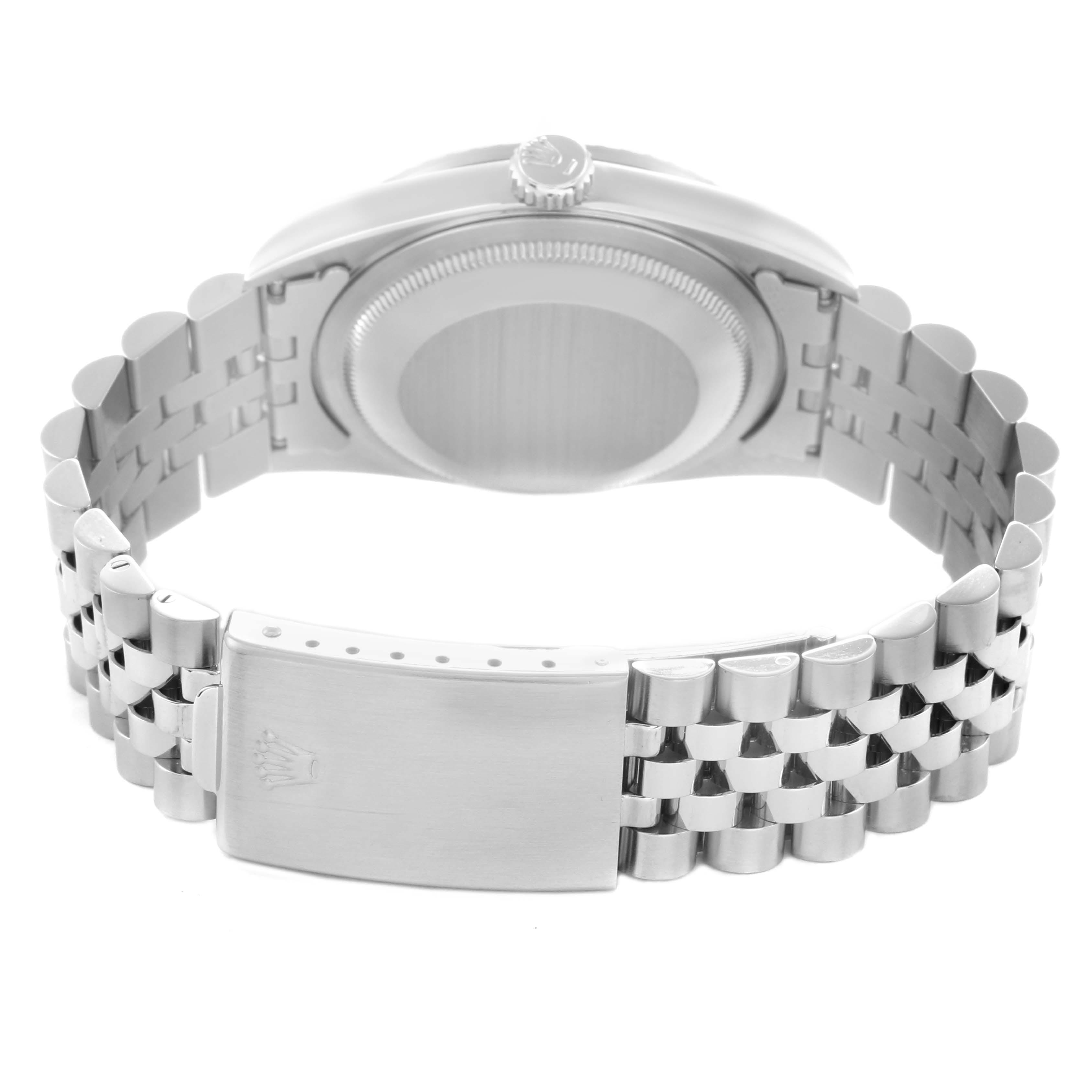 The image shows the Rolex Datejust 16220 Men
s Stainless Steel Black Dial 16220 Men
s Stainless Steel Black Dial watch from the back, highlighting the case back and bracelet clasp.