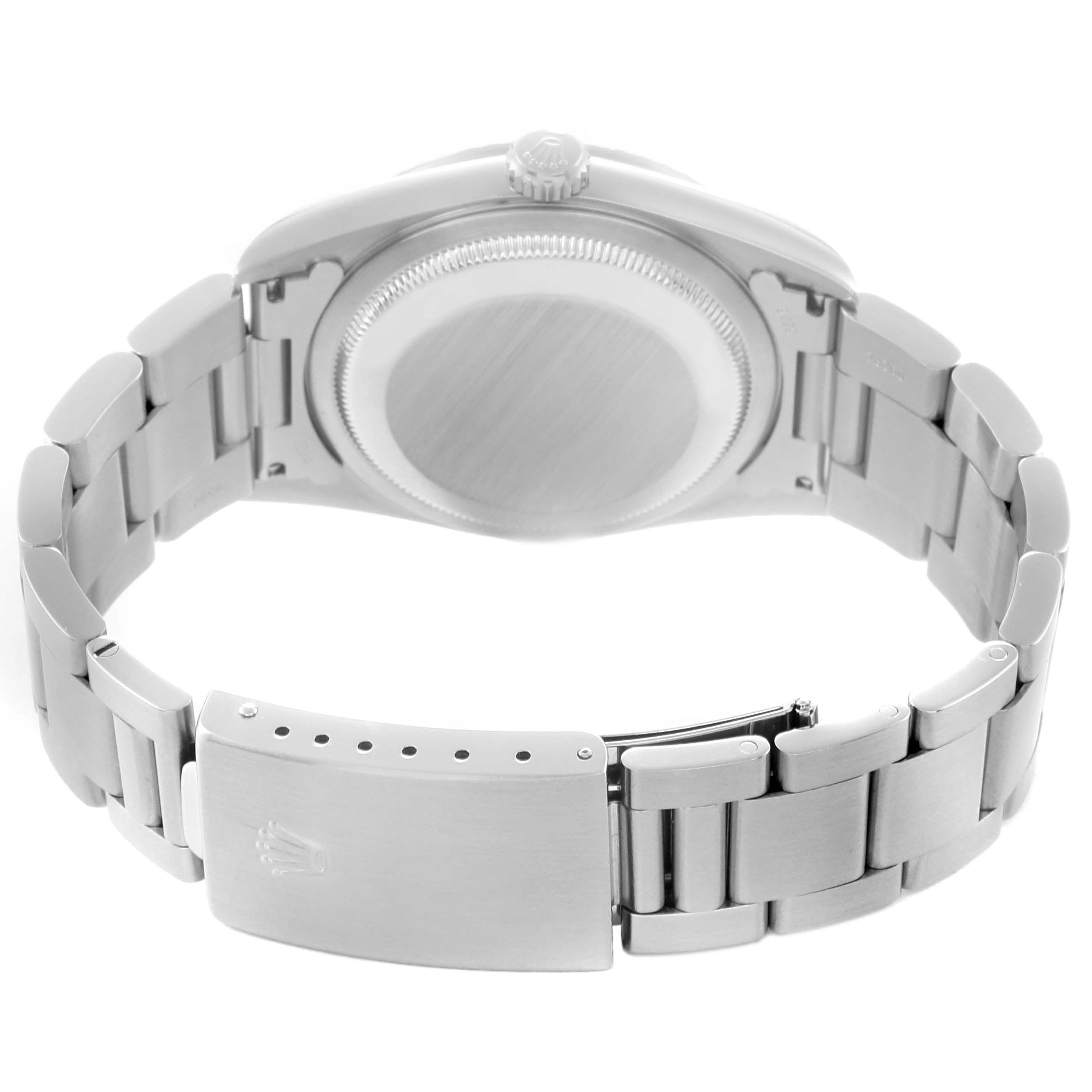 The Rolex Datejust 16220 Men
s Stainless Steel Black Dial 16220 Men
s Stainless Steel Black Dial model is shown from the back, highlighting the case back, crown, and bracelet clasp.