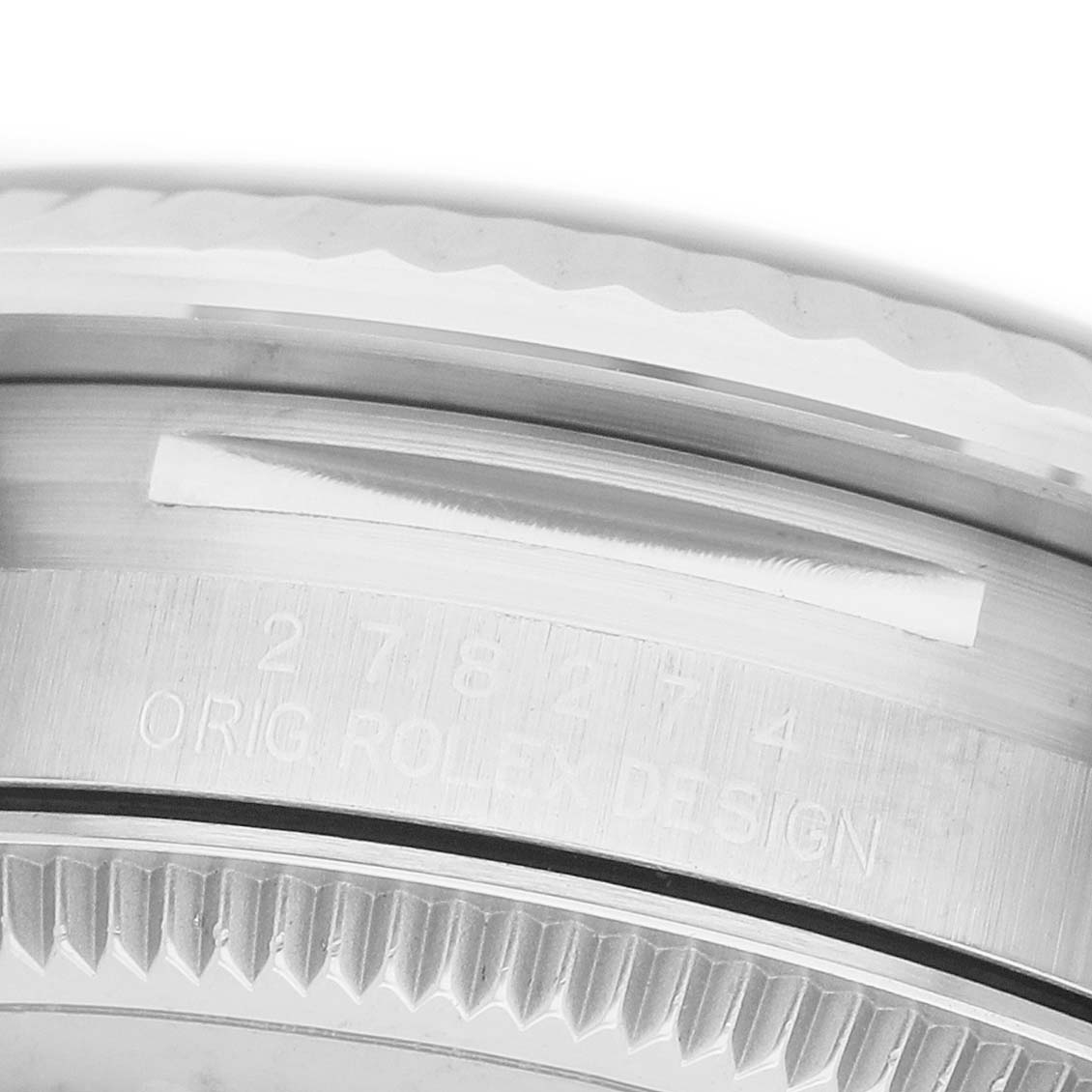 The image shows a close-up side view of the Rolex Datejust 278274 Men's Stainless Steel Silver Dial watch's engraved bezel and case.