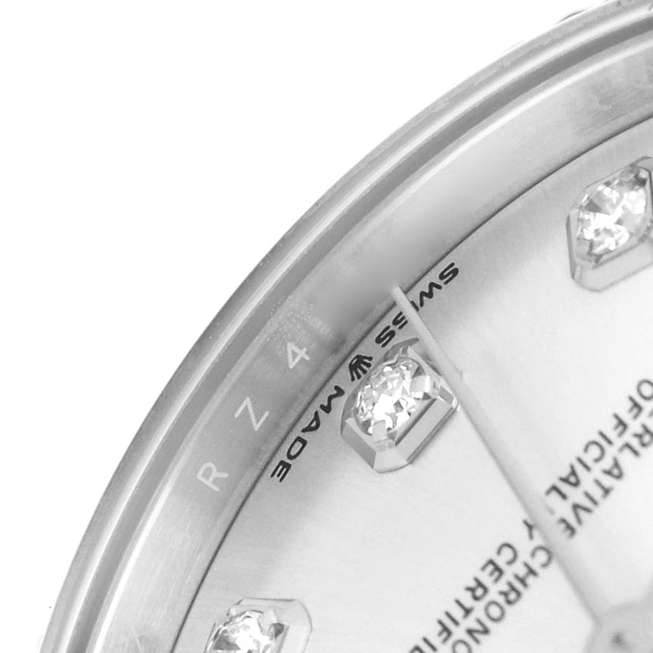 The image shows a close-up of the Rolex Datejust 278274 Men's Stainless Steel Silver Dial watch face, highlighting diamond hour markers and partial text.