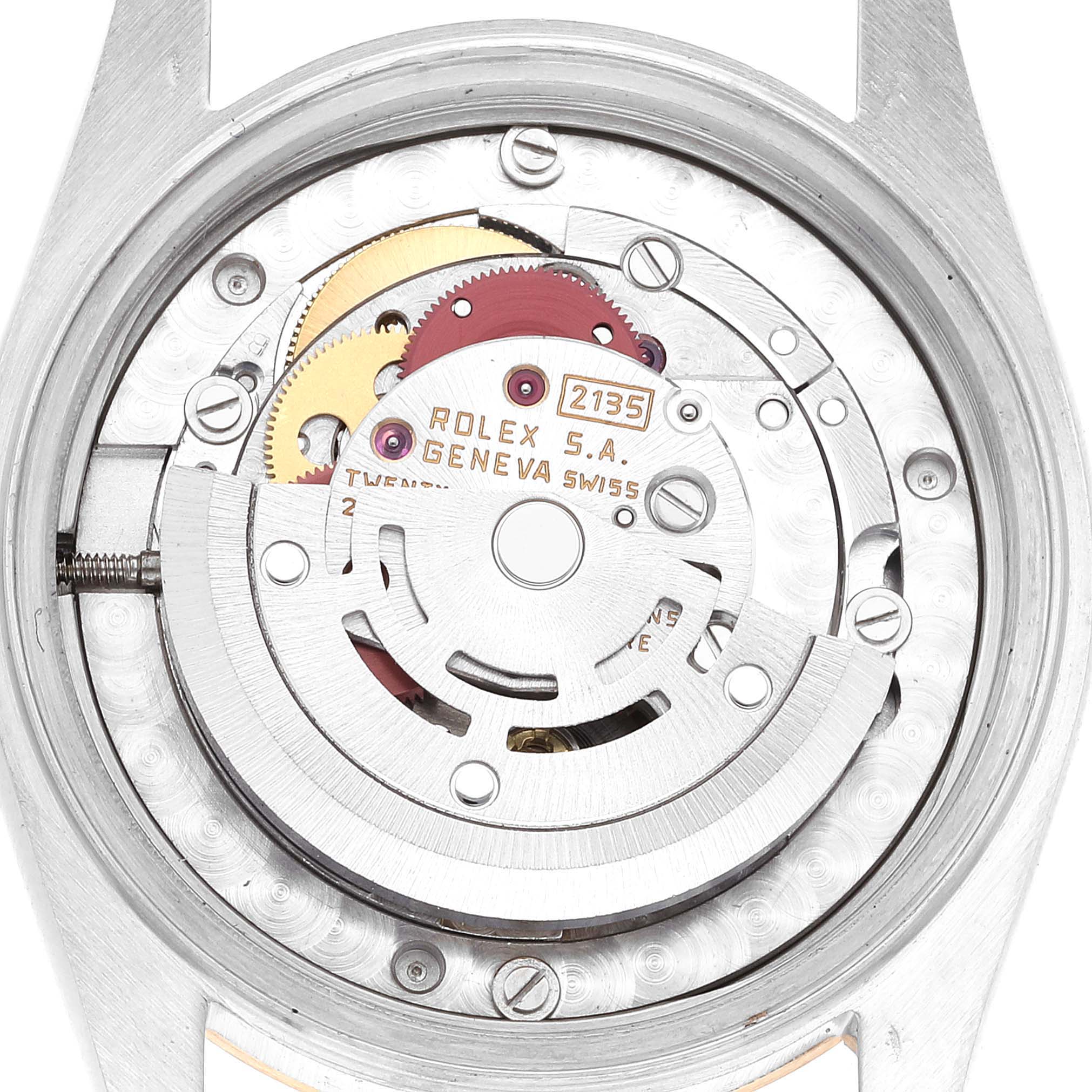 The image shows the internal mechanical movement parts of a Mid-Size Rolex watch model, focusing on gears and the rotor.