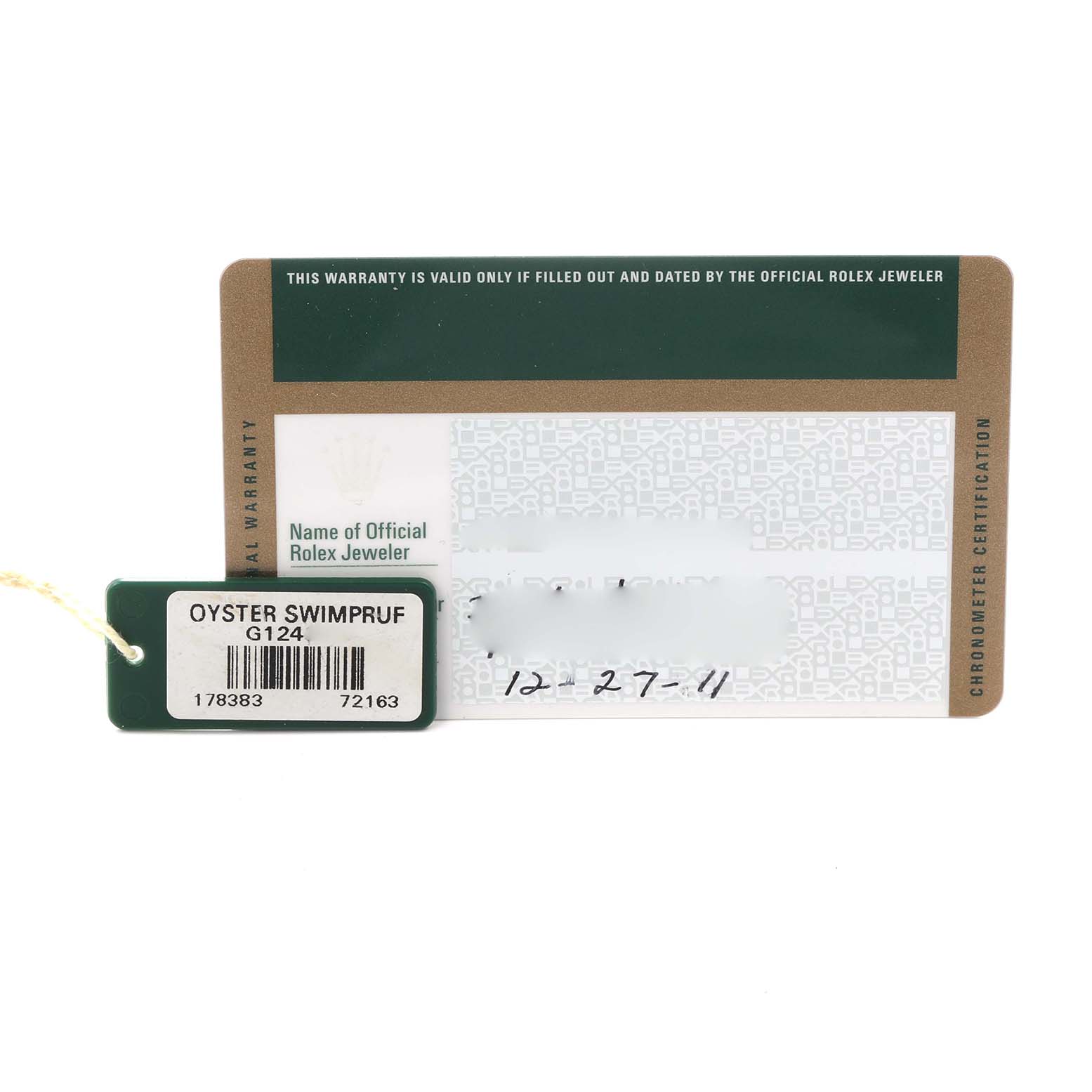 The image shows a warranty card and an Oyster Swimpruf tag for the Rolex Datejust model.
