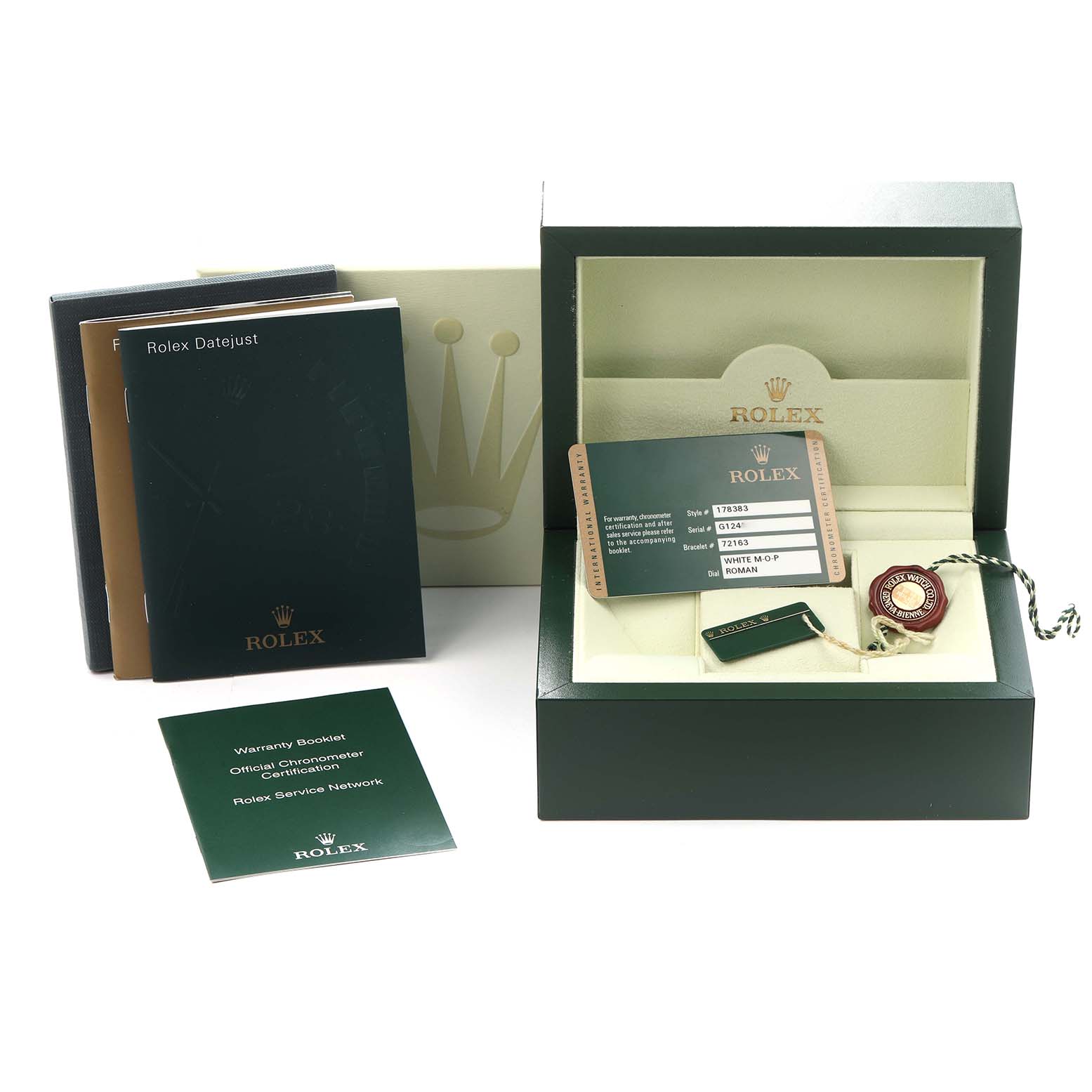 The image shows the packaging, booklets, warranty card, and accessories for a Rolex Datejust watch.